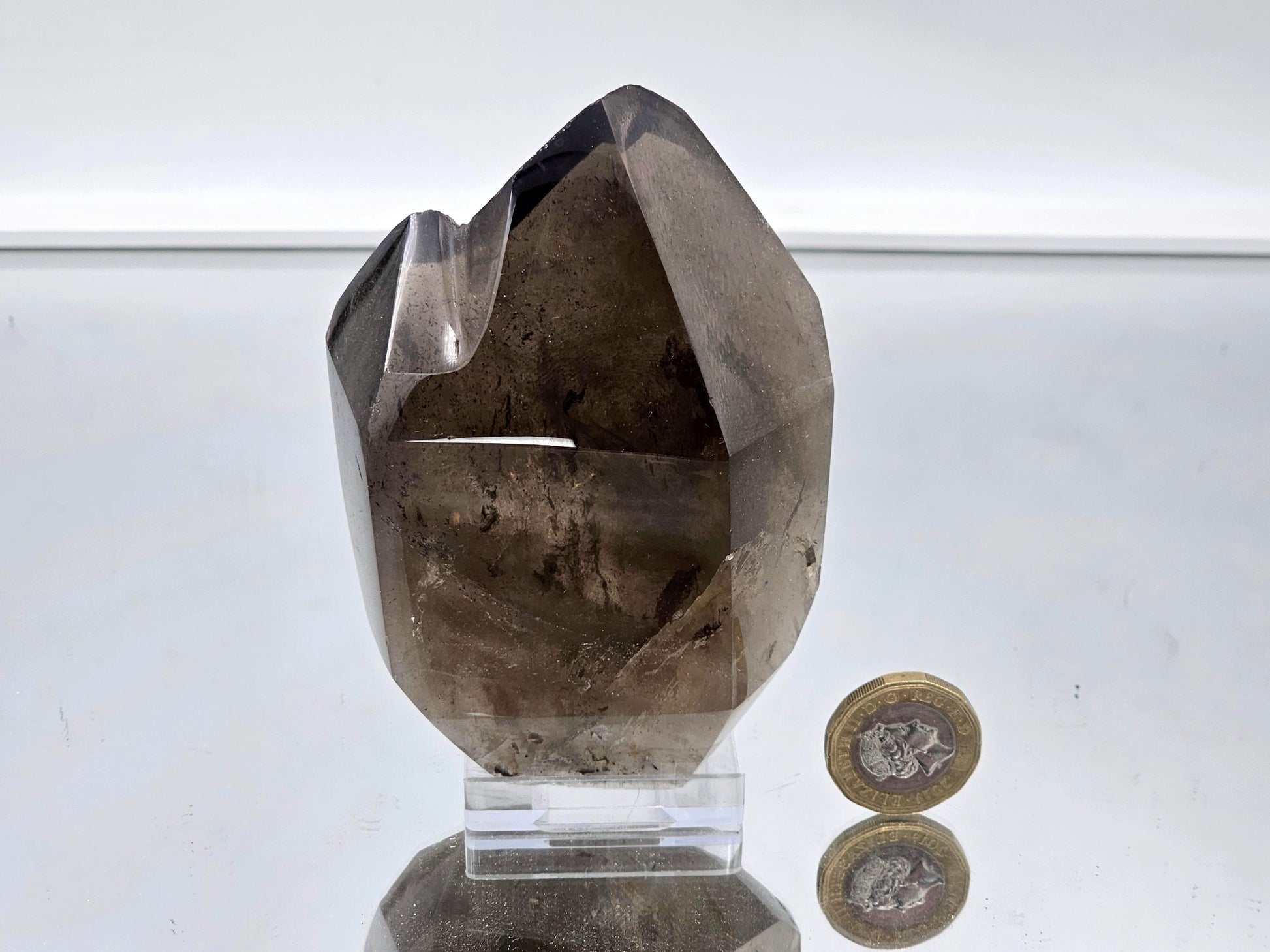 Polished smoky quartz crystal centerpiece, perfect for luxury decor.