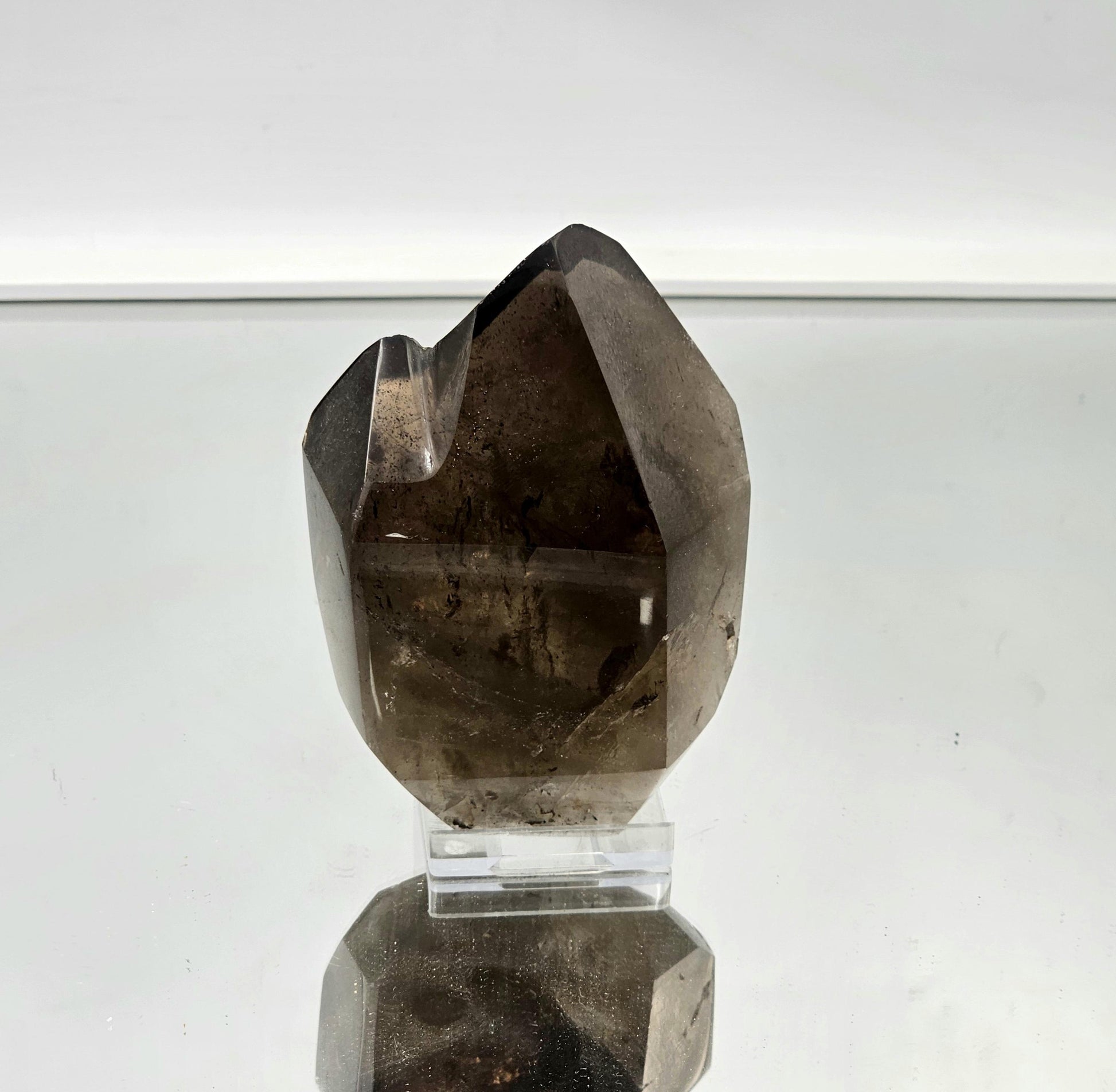 Smoky quartz crystal on display, adding grounding energy to home decor