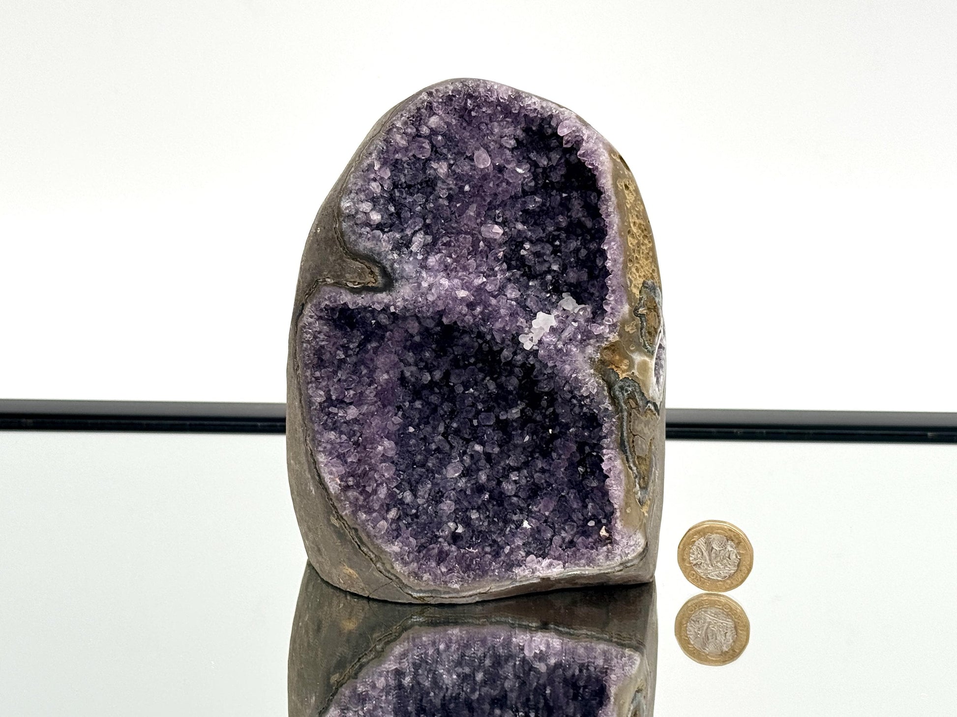 Large Uruguayan Amethyst Crystal Geode (AMU33) showcasing deep purple interior and polished exterior.