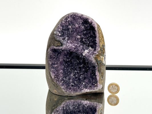 Large Uruguayan Amethyst Crystal Geode (AMU33) showcasing deep purple interior and polished exterior.