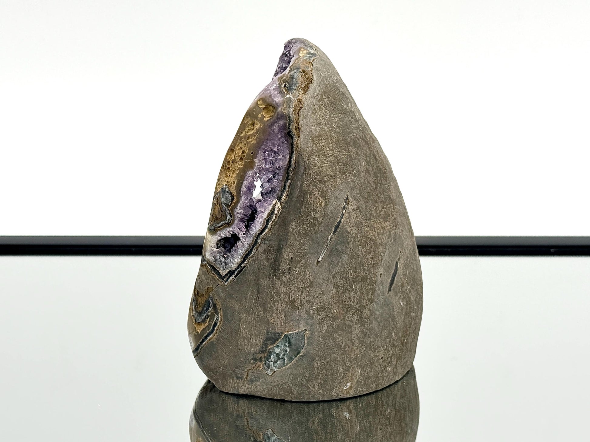 Large Uruguayan Amethyst Crystal Geode (AMU33) showcasing stunning violet quartz formations in polished rock.