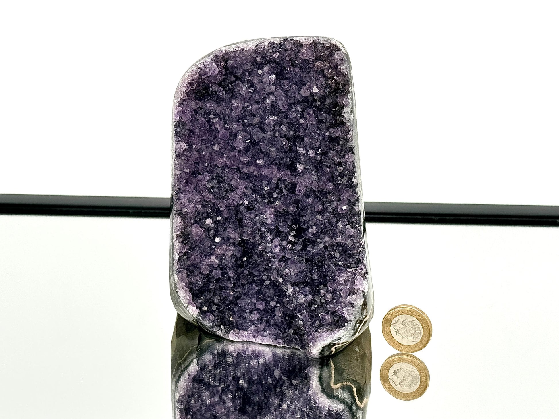 Large Uruguayan Amethyst Crystal Geode showcasing beautiful violet hues and polished edges.