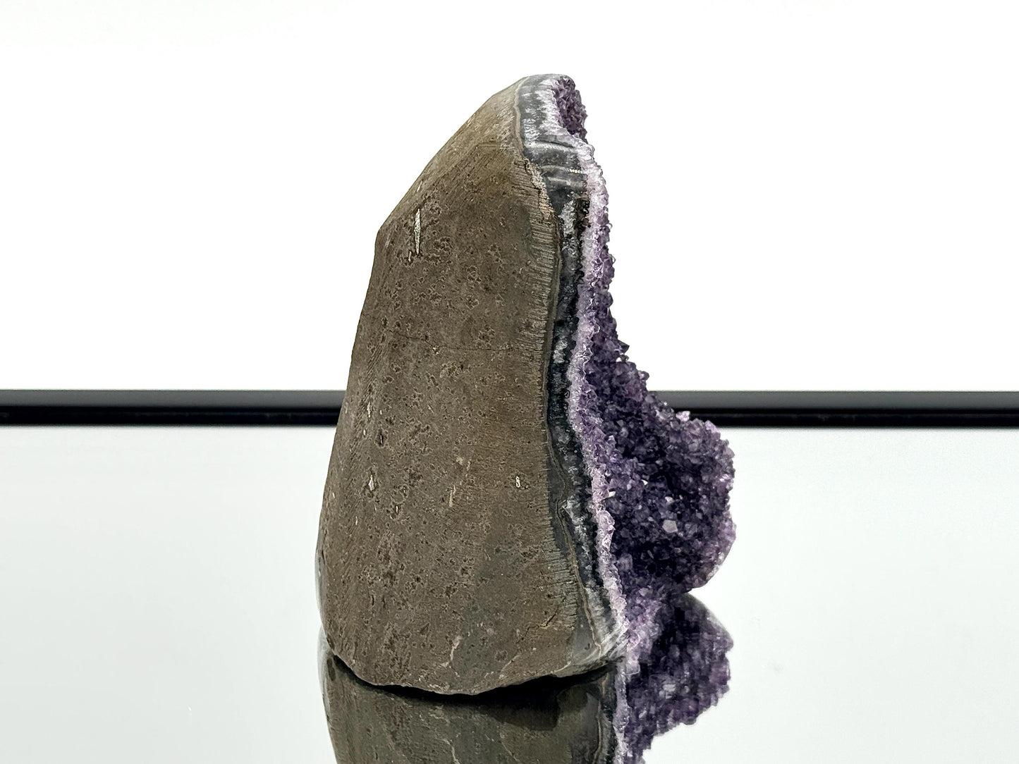 Large Uruguayan Amethyst Crystal Geode, showcasing natural amethyst crystals and polished sides.