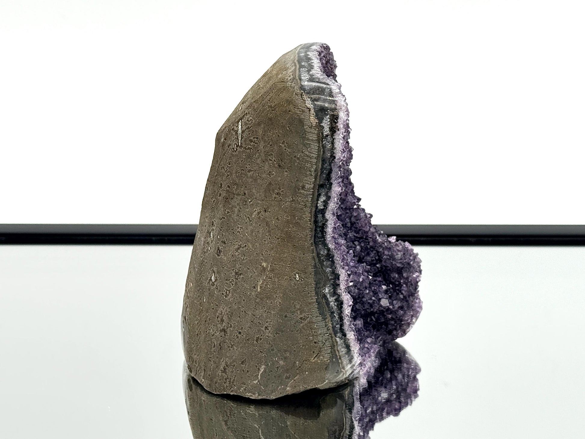 Large Uruguayan Amethyst Crystal Geode, showcasing natural amethyst crystals and polished sides.