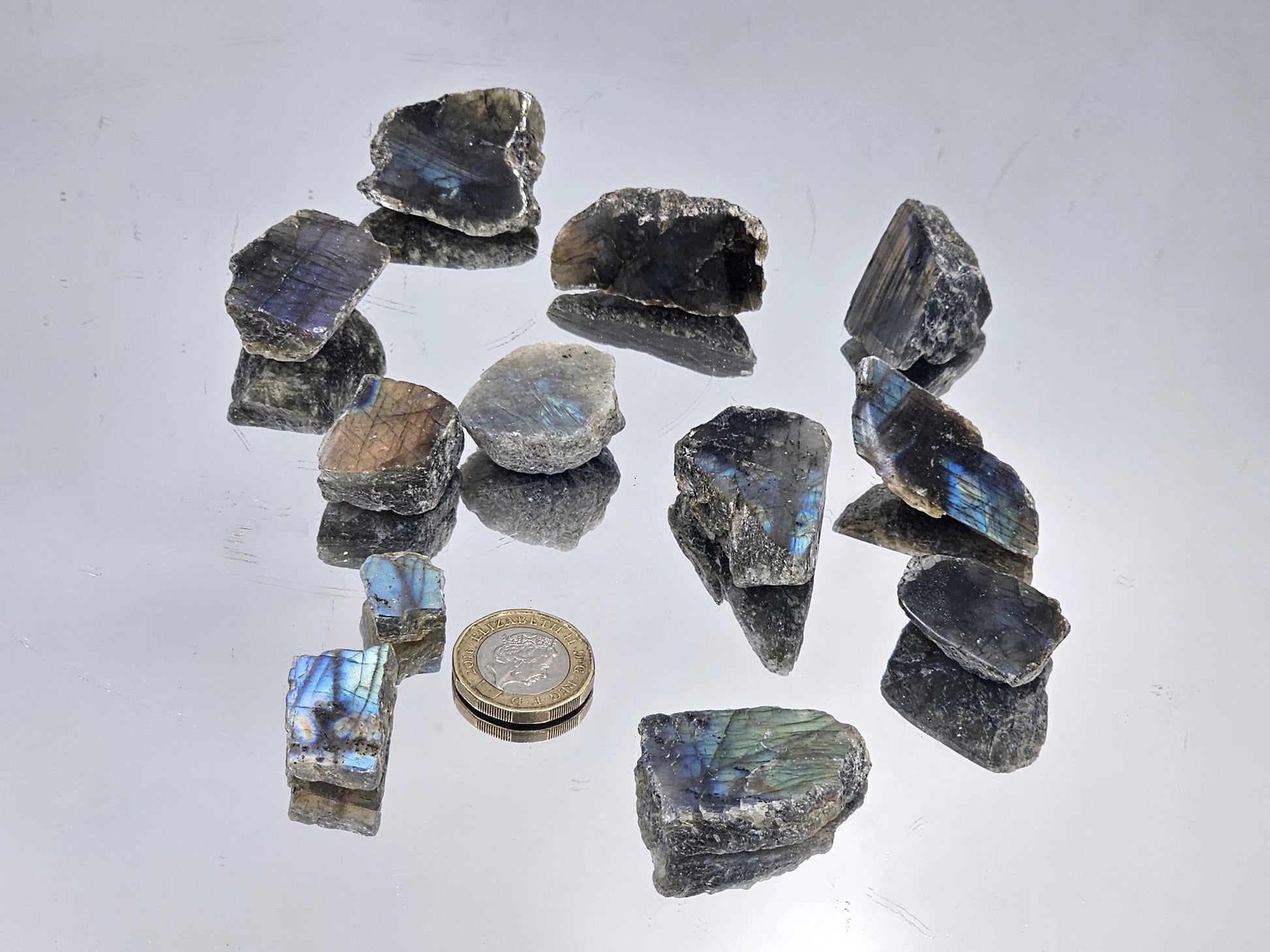 Batch of small Labradorite crystal slices, 150g, showcasing vibrant blue and green flashes.