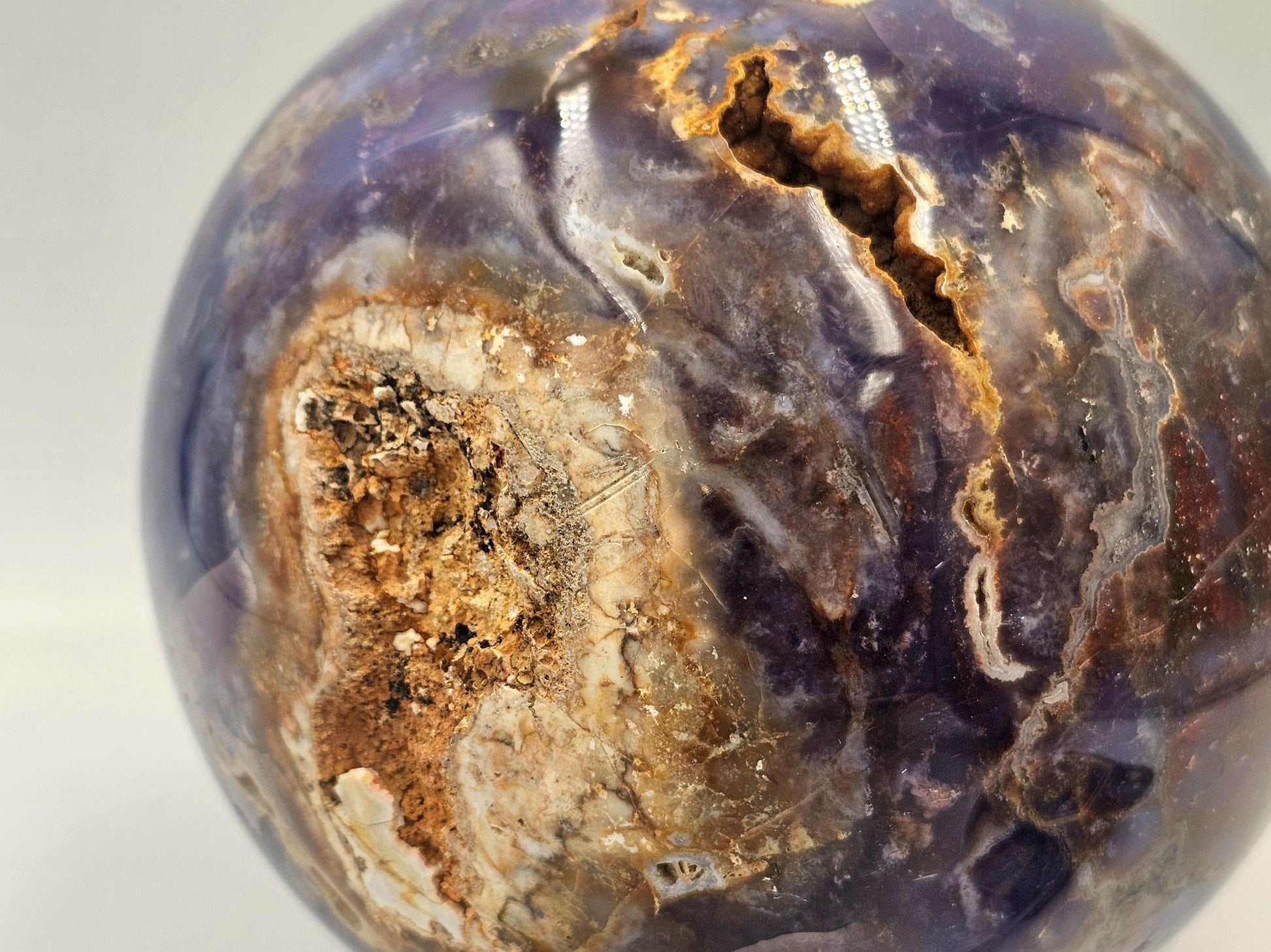 Elegant violet agate crystal sphere displayed as a centerpiece for home décor