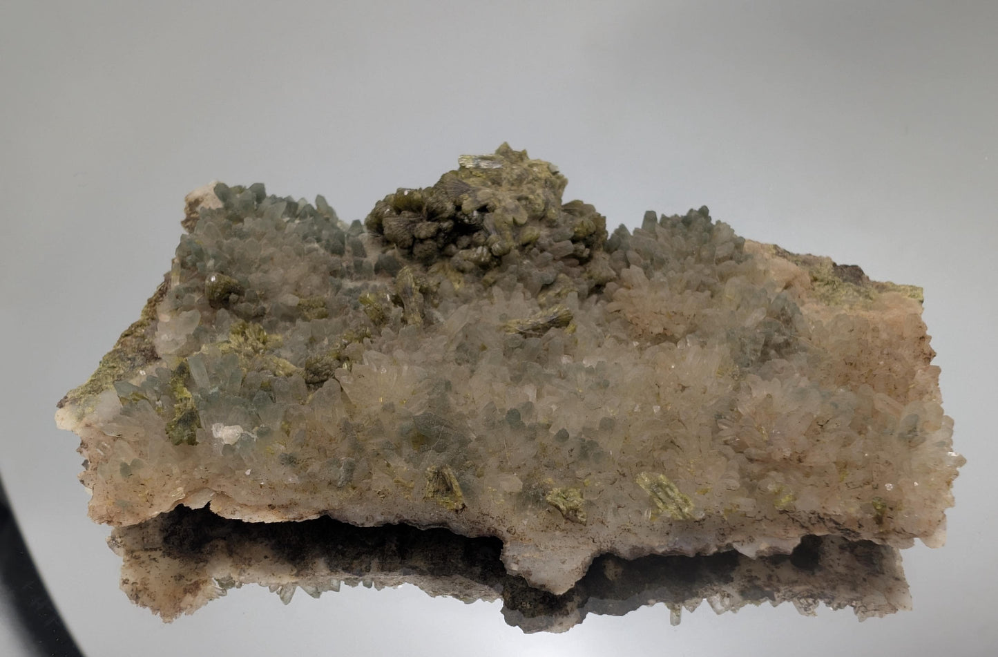 Hand-selected Forest Epidote on Quartz with exceptional natural beauty. A luxurious display crystal for refined home and office décor.