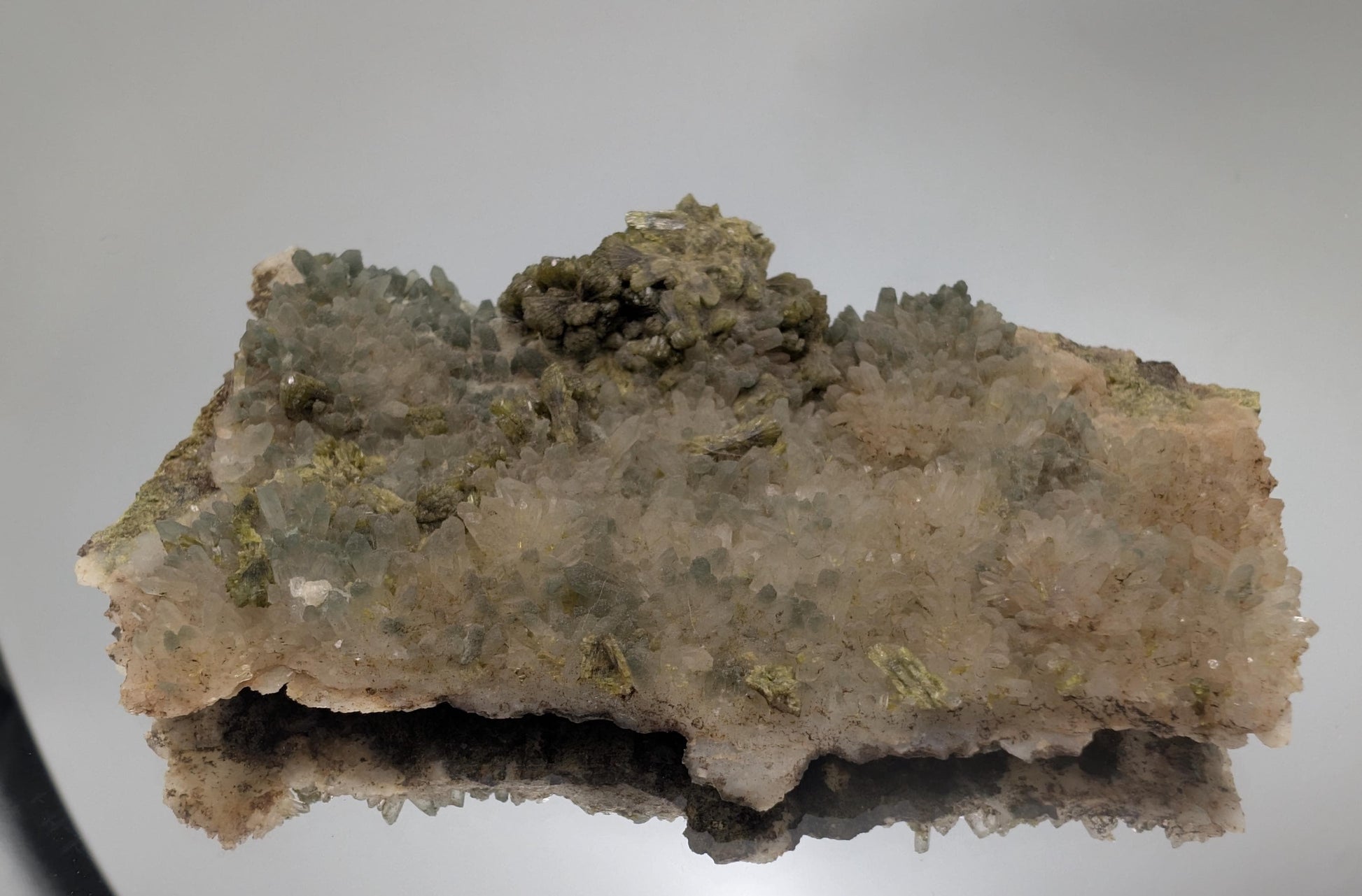Hand-selected Forest Epidote on Quartz with exceptional natural beauty. A luxurious display crystal for refined home and office décor.