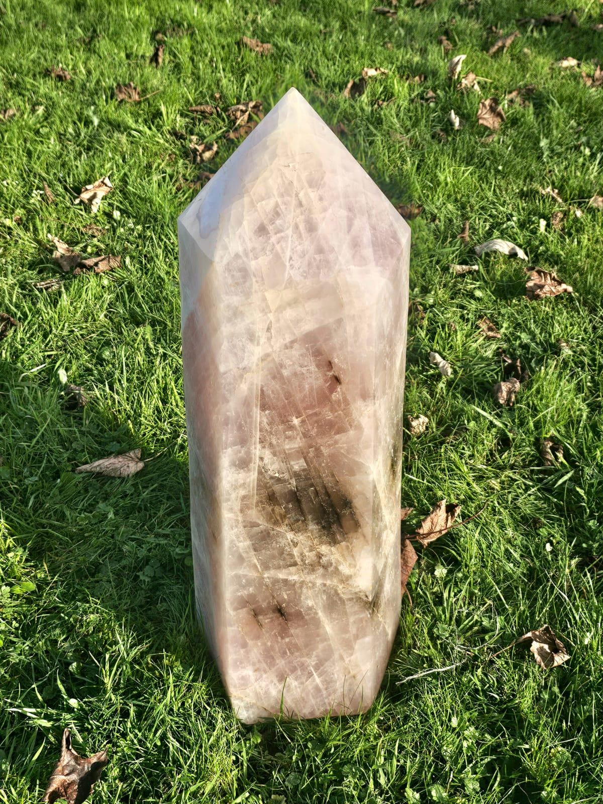 Freestanding Rose Quartz tower crystal with smoky quartz inclusions