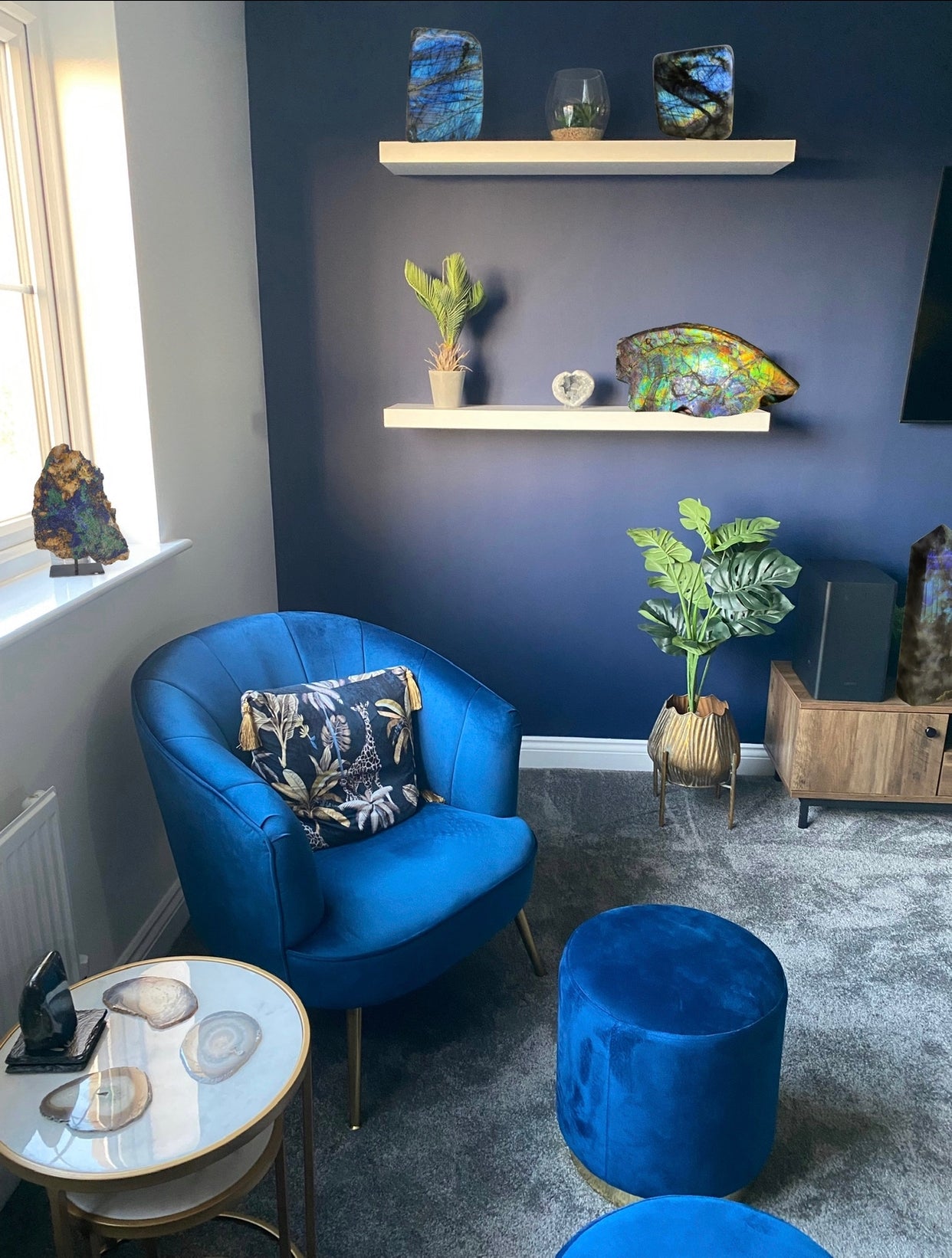 holistic interior design crystals, wabi-sabi living room interior styled with crystals, agate coasters, azurite on stand, ammolite crystal, statement crystals, unique home decor, crystals uk