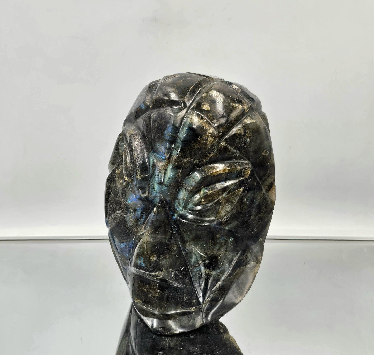 Labradorite face carving with polished front and natural raw back