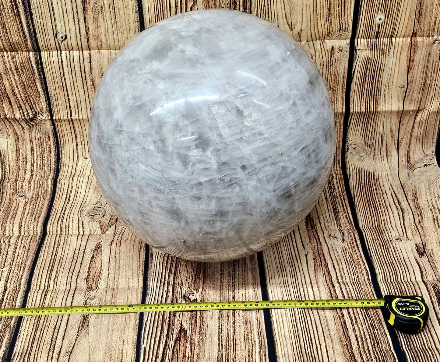 Madagascar-sourced quartz crystal sphere radiating harmonious energy in a meditation space.