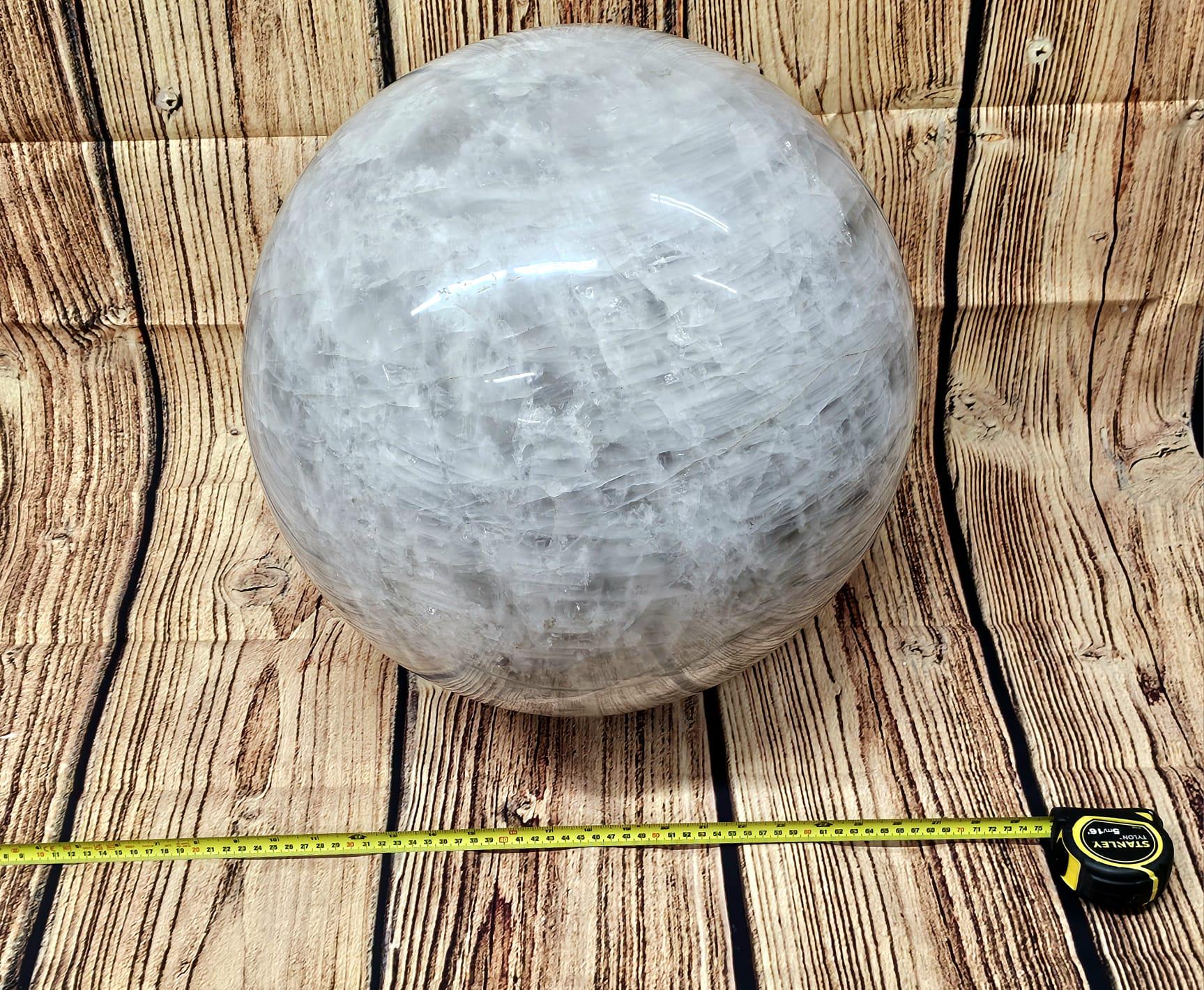 Madagascar-sourced quartz crystal sphere radiating harmonious energy in a meditation space.