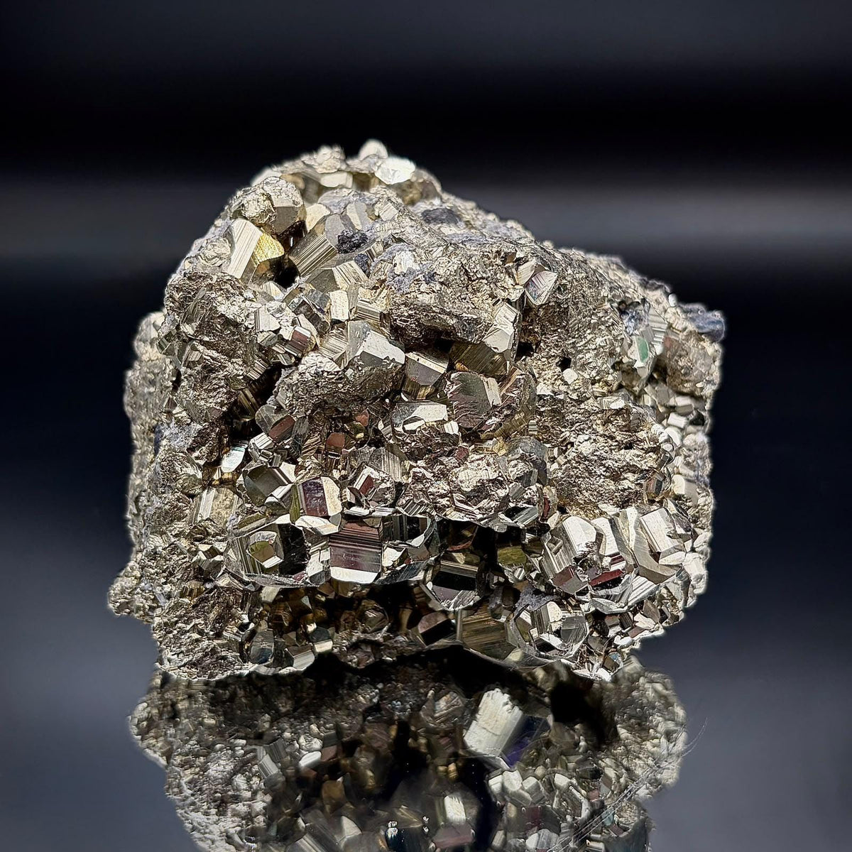 ndividual high-grade Peruvian Pyrite specimen showcasing its natural crystal formations and reflective metallic lustre.