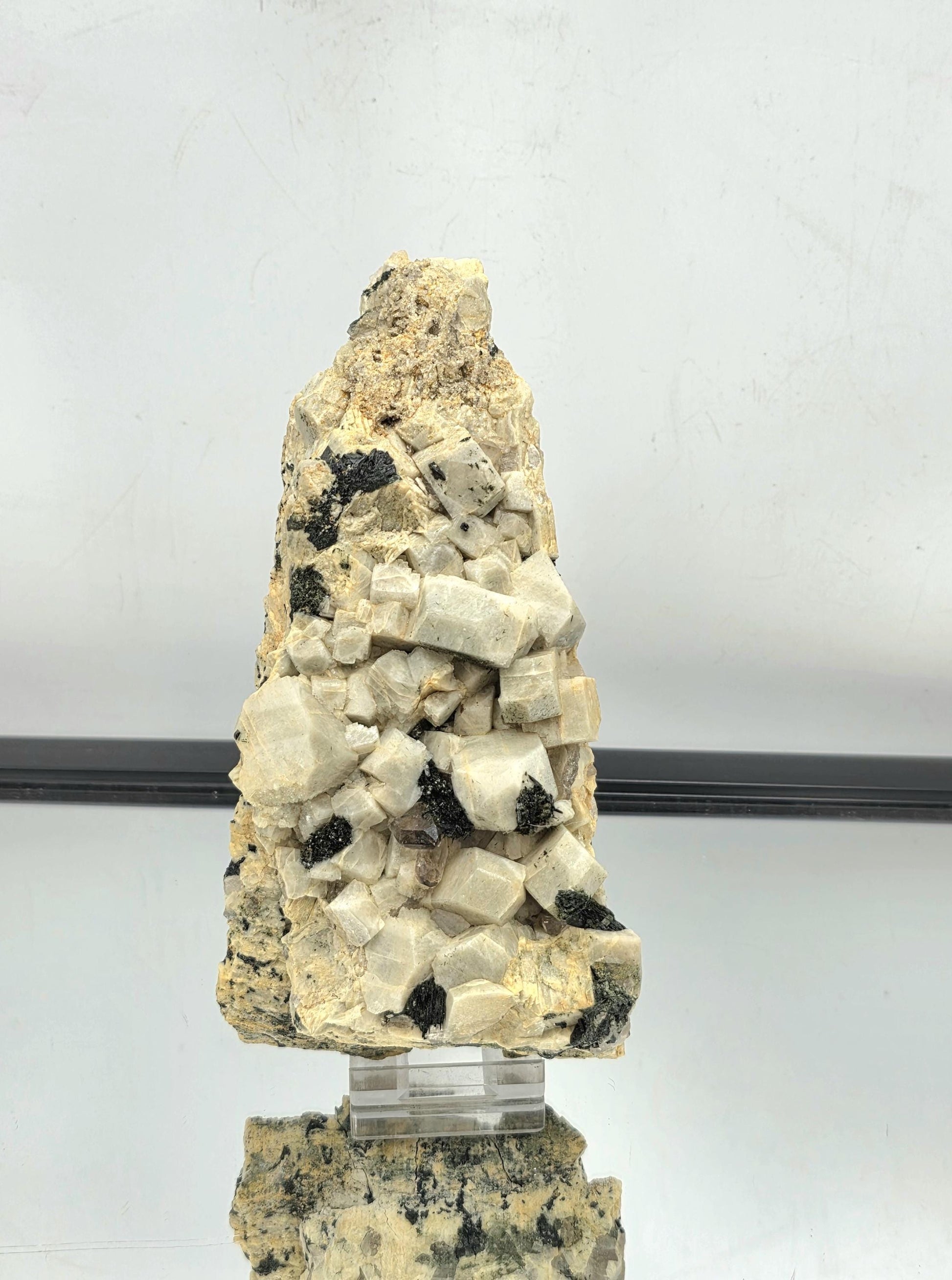 Natural crystal formation featuring Aegirine and Smoky Quartz on Orthoclase.