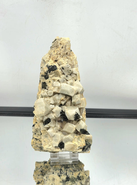 Natural crystal formation featuring Aegirine and Smoky Quartz on Orthoclase.