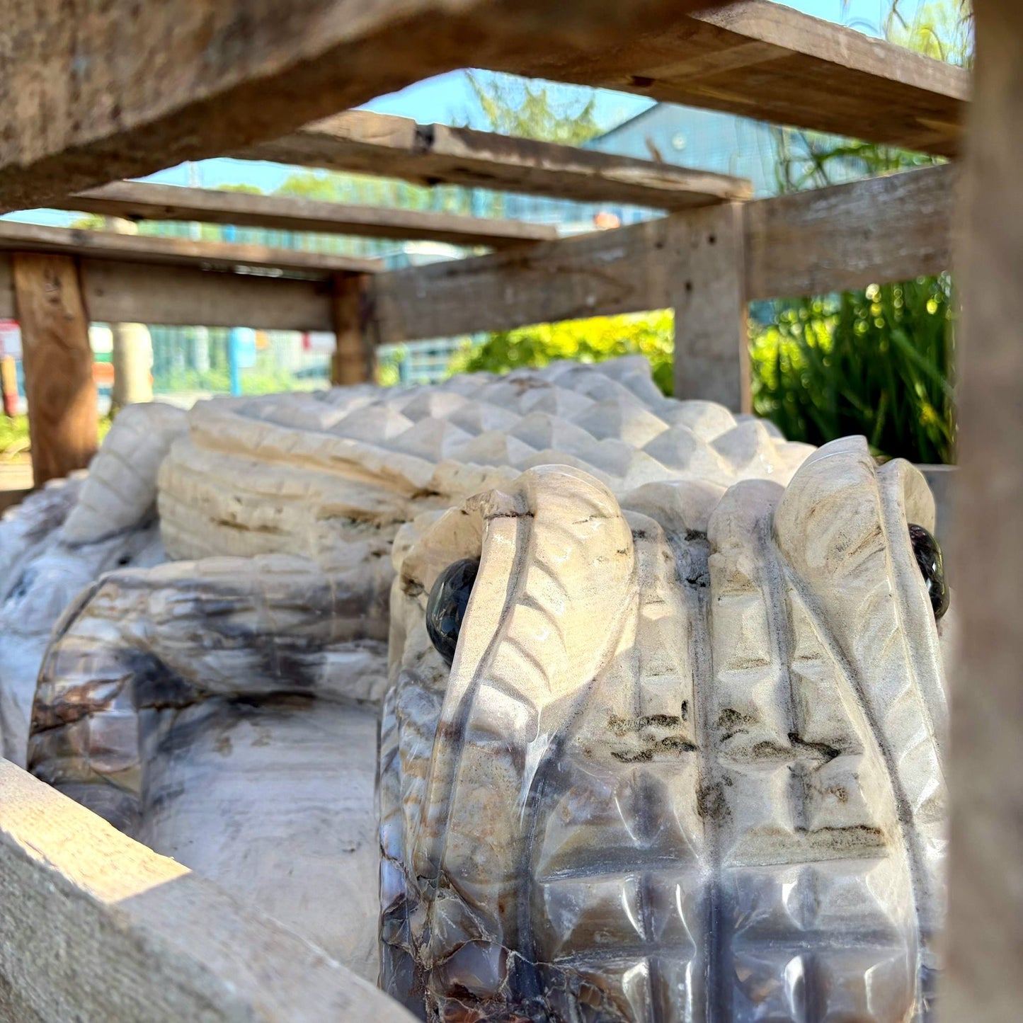 full length profile of agate crocodile sculpture