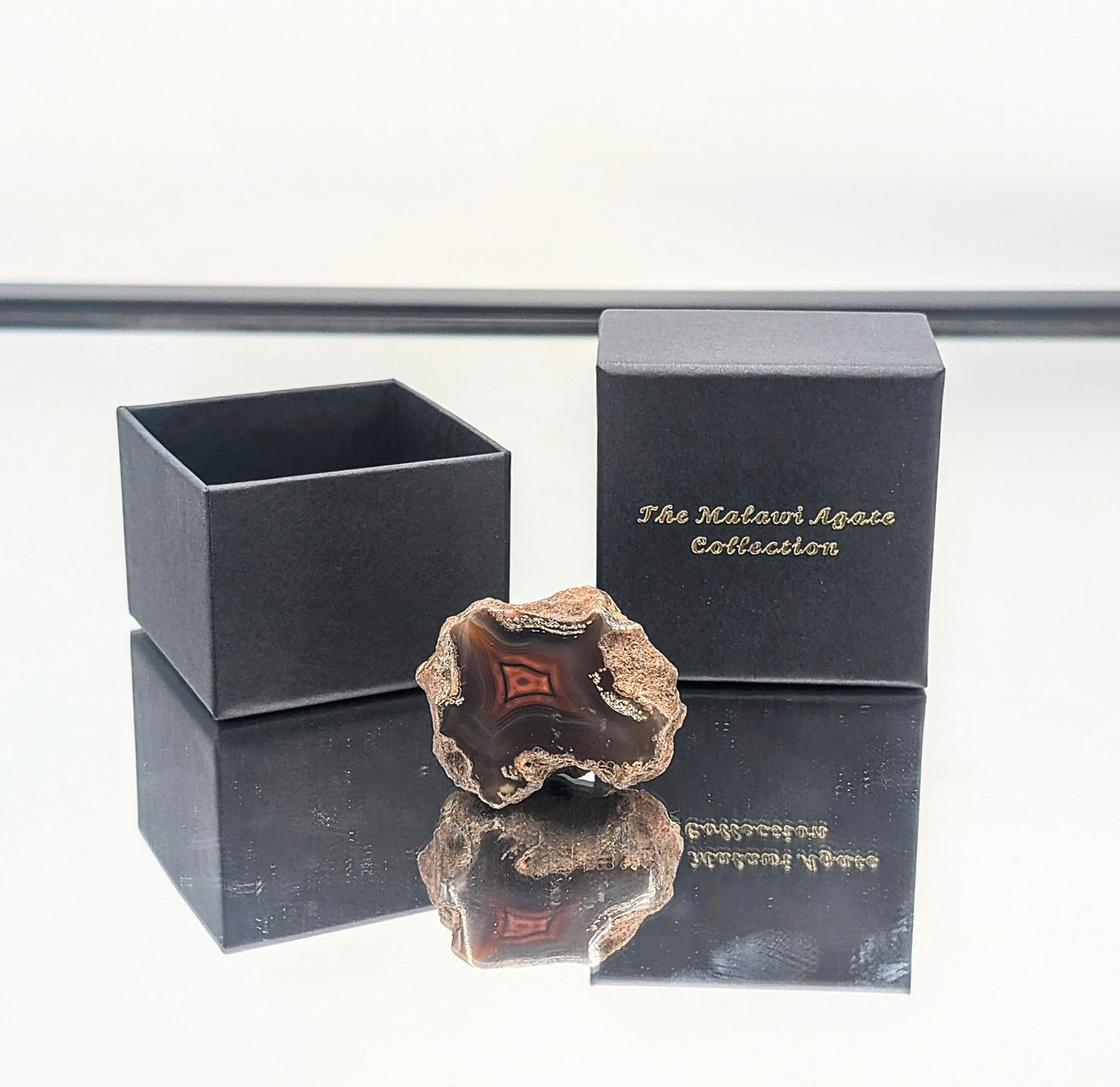 A premium agate gift collection featuring rare Malawi crystals in a luxury box.