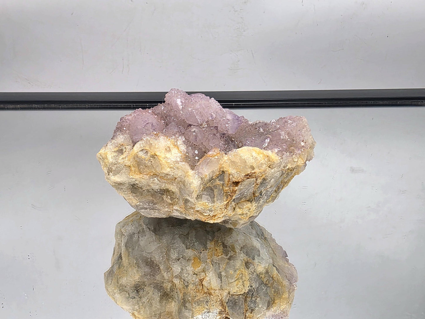 Natural lavender Amethyst quartz crystal with shimmering clarity.