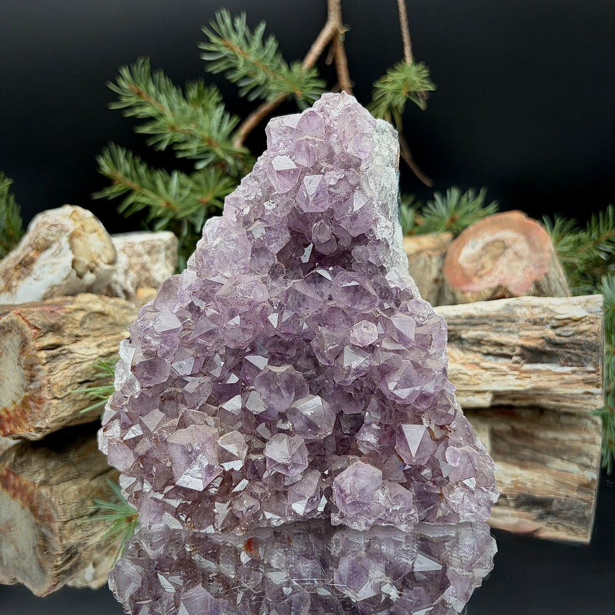 Freestanding Amethyst crystal cut base featuring natural purple quartz formations.