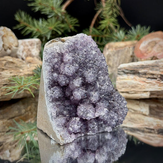 Natural Amethyst crystal cut base featuring purple quartz formations for decorative home display.