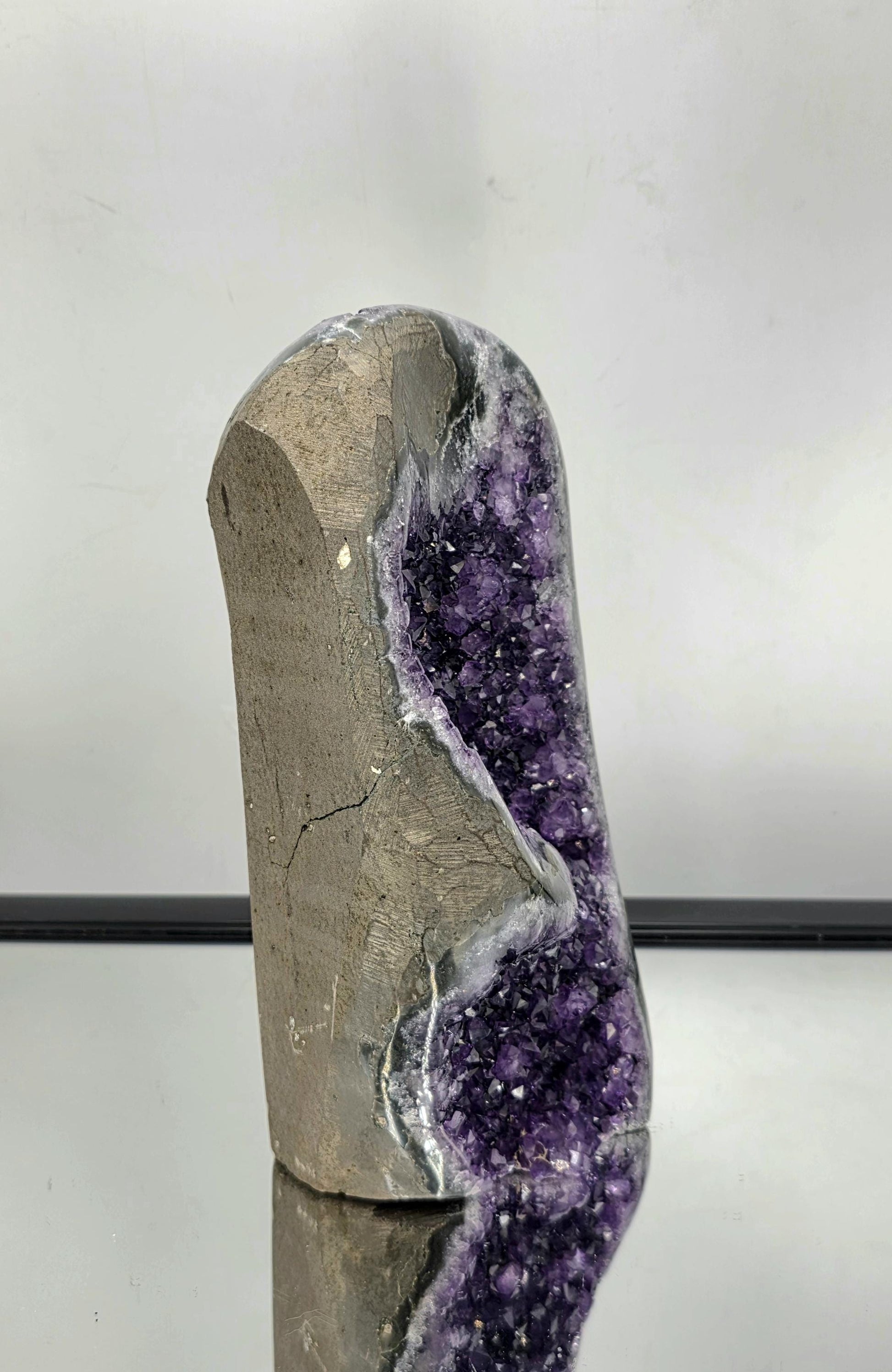 Natural Amethyst mineral specimen with crystal points