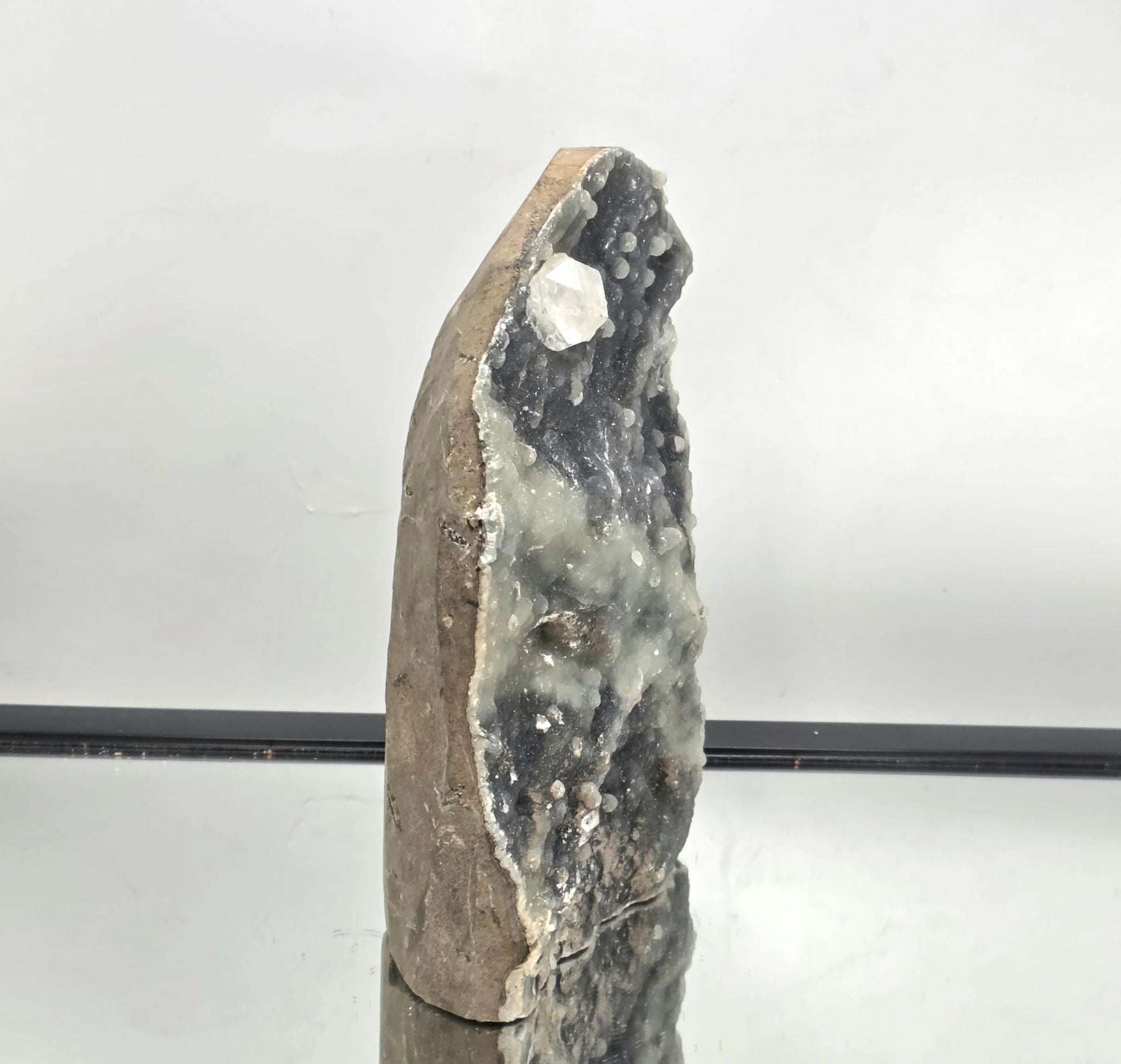 Close-up of apophyllite points growing on chalcedony matrix