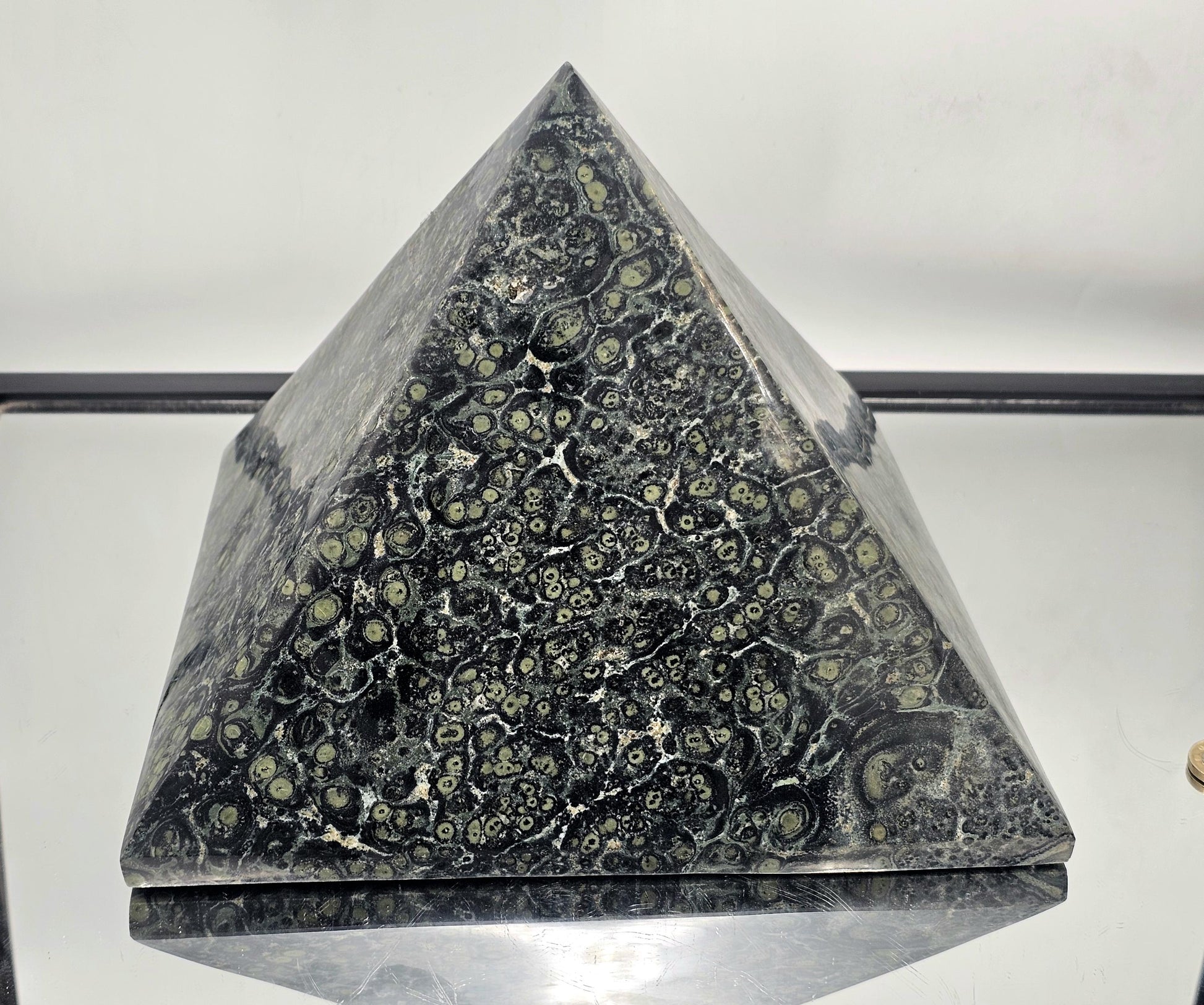 Large polished Kambaba Jasper pyramid, a unique décor item.