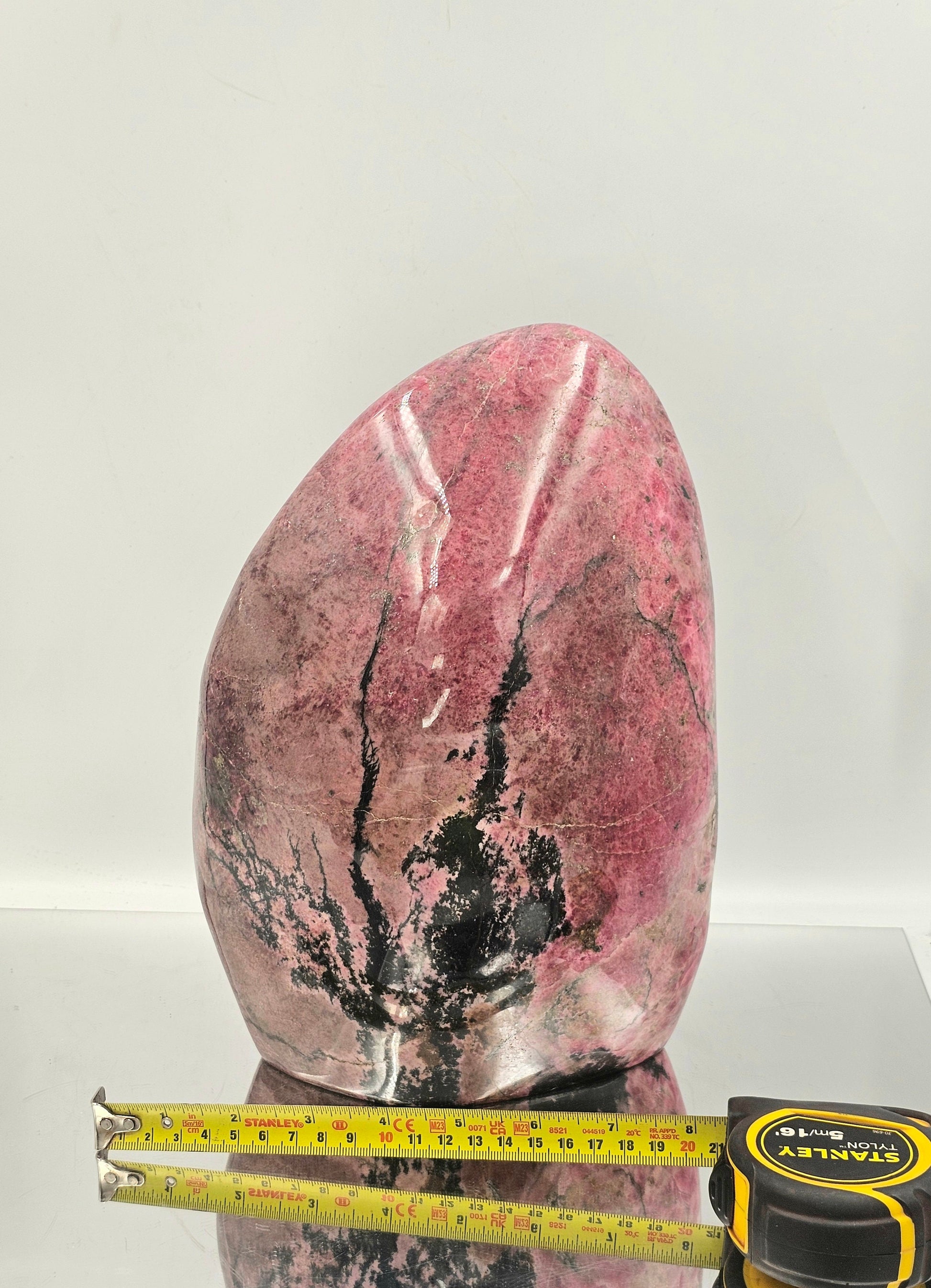 big pink and black rhodonite crystal freeform
