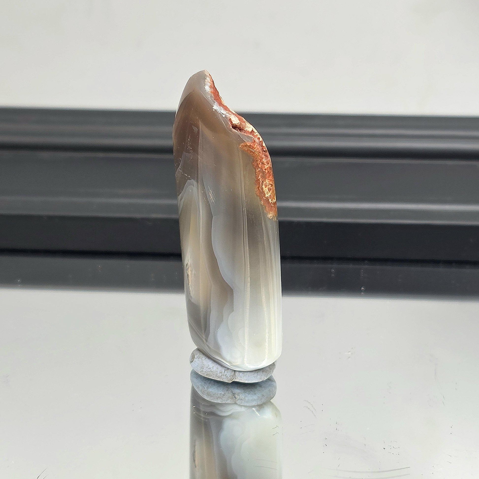 Black banded agate with polished surface.