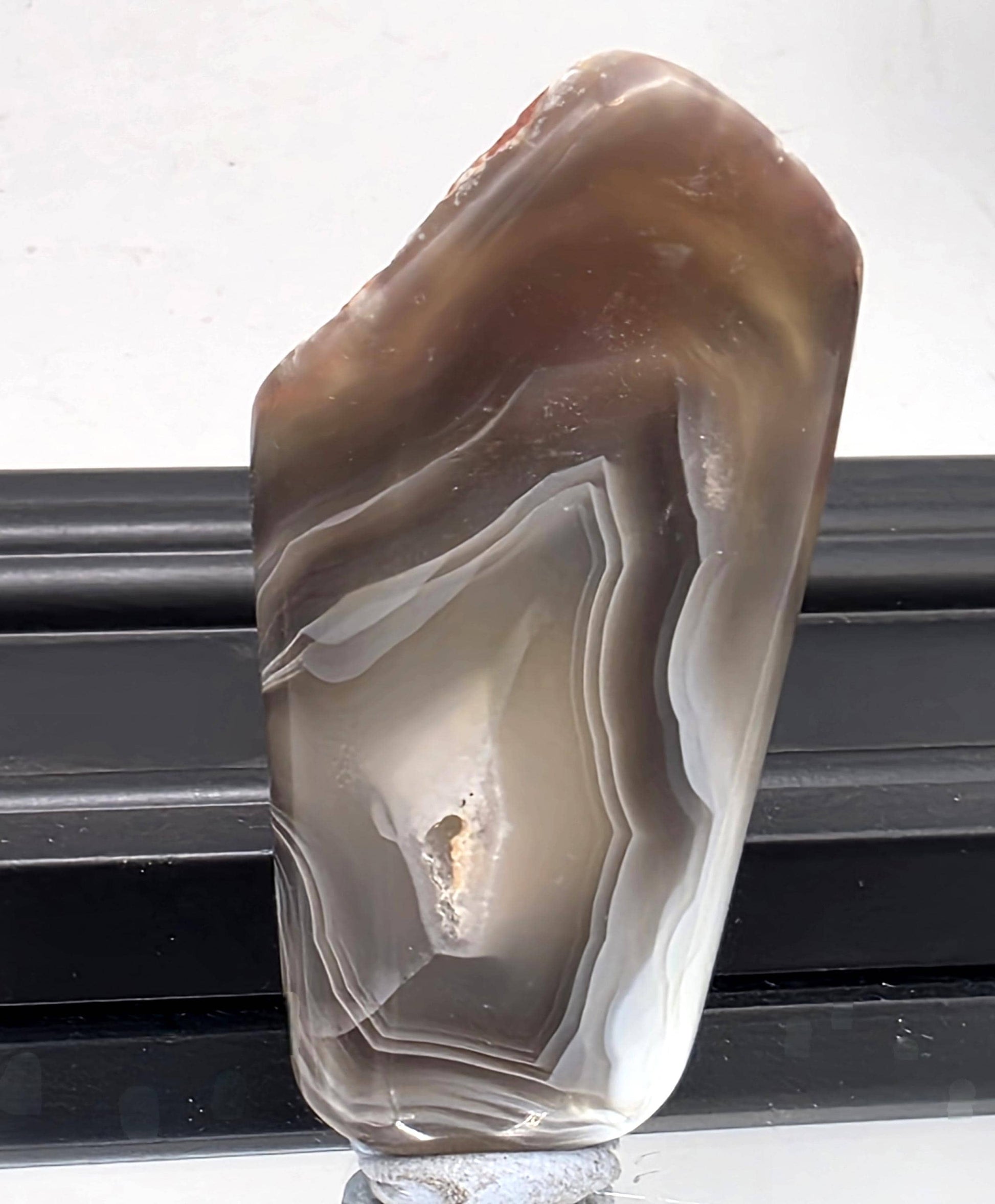 Malawi agate with striking black band patterns.