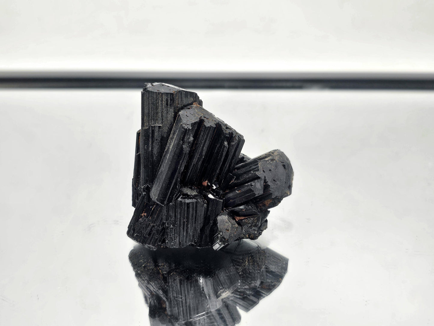 Luxury raw Black Tourmaline crystal with natural formation, part of a curated collection.