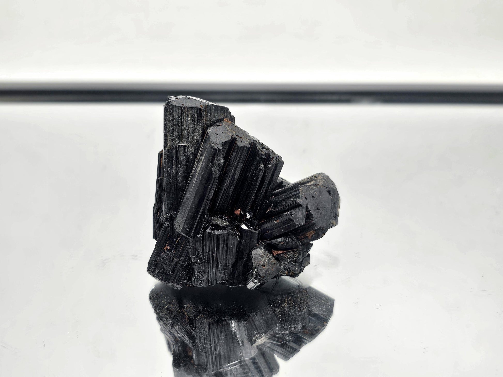 Luxury raw Black Tourmaline crystal with natural formation, part of a curated collection.