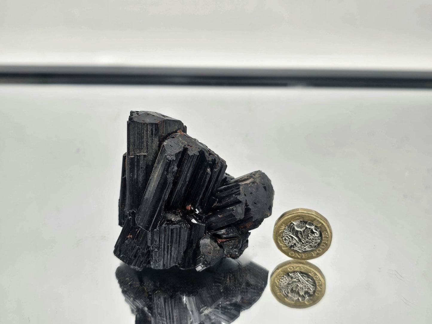 Unique raw Black Tourmaline crystal with distinct, unpolished texture and natural energy.