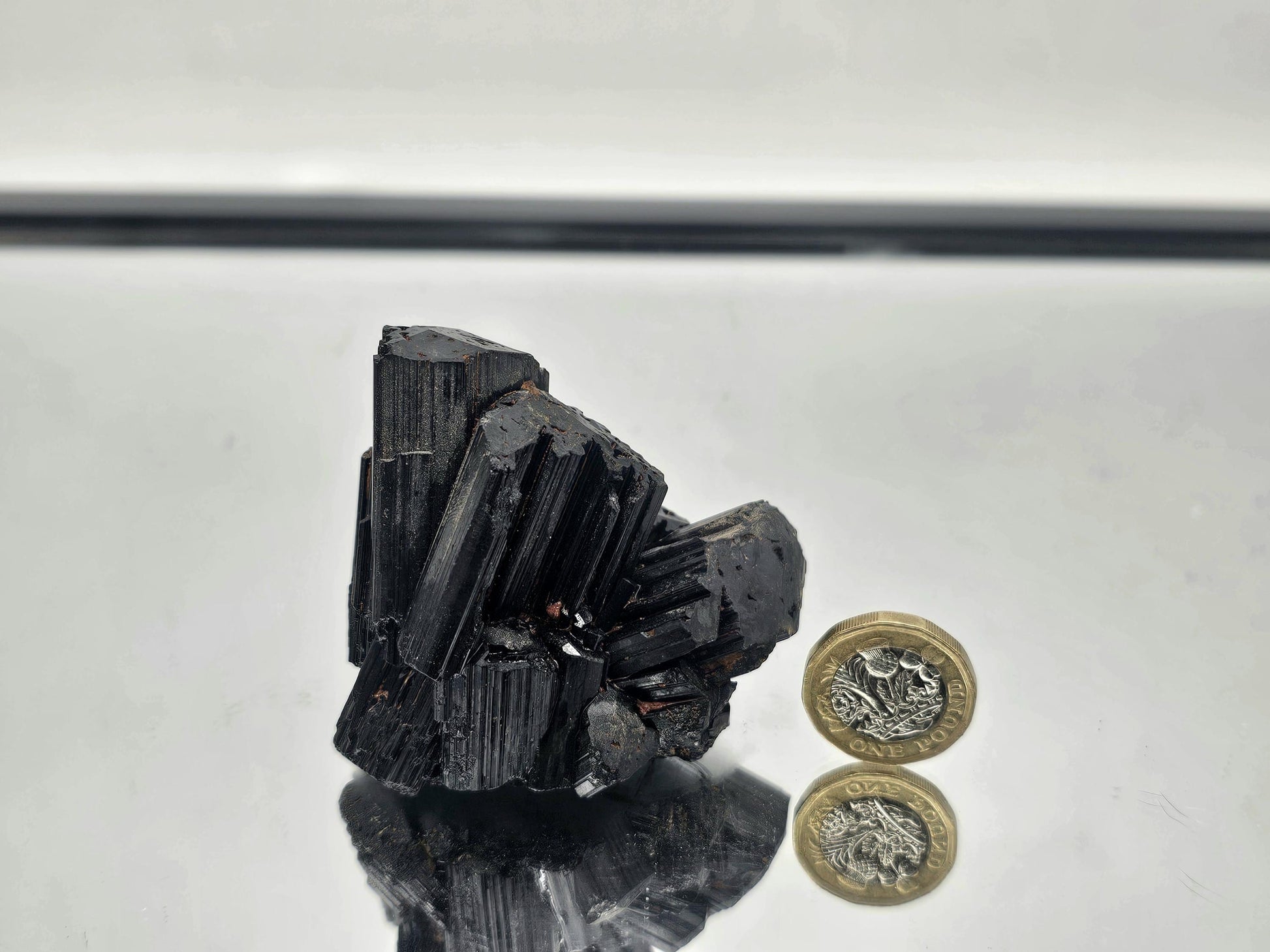 Unique raw Black Tourmaline crystal with distinct, unpolished texture and natural energy.