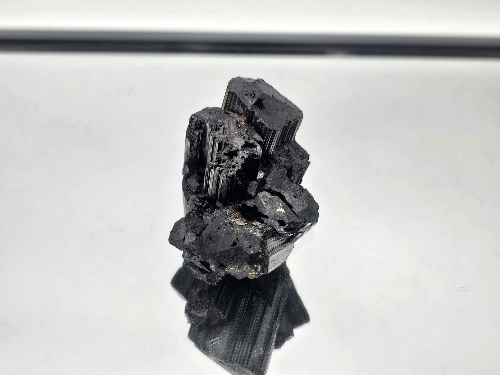 Unique raw Black Tourmaline crystal with distinct, unpolished texture and natural energy.