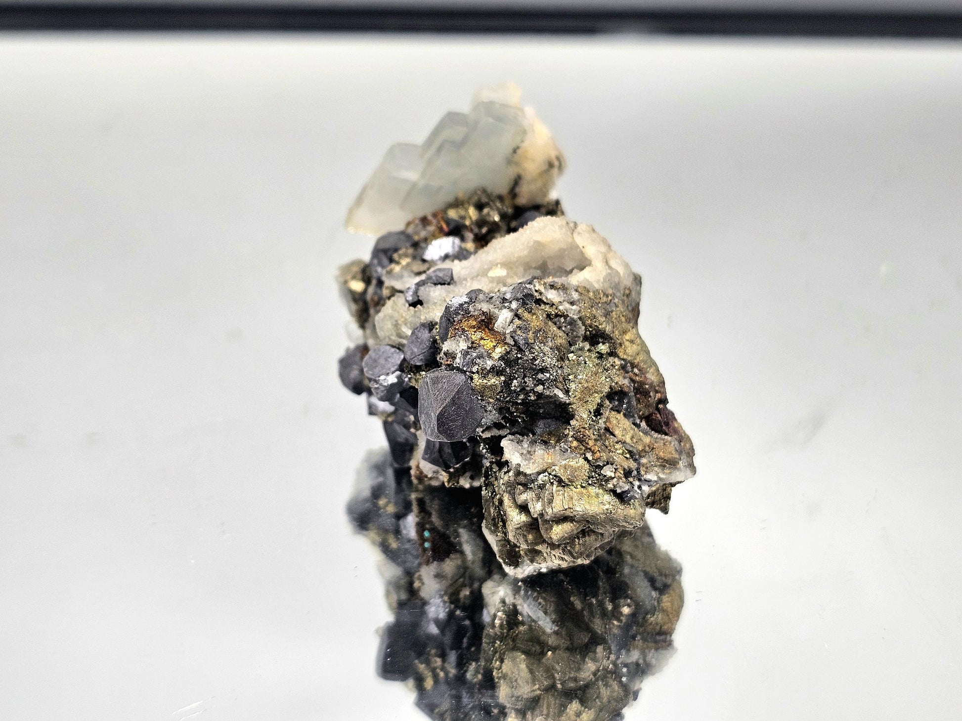 Stunning combination of Blue Baryte, Galena, and Chalcopyrite, showcasing metallic and iridescent hues.