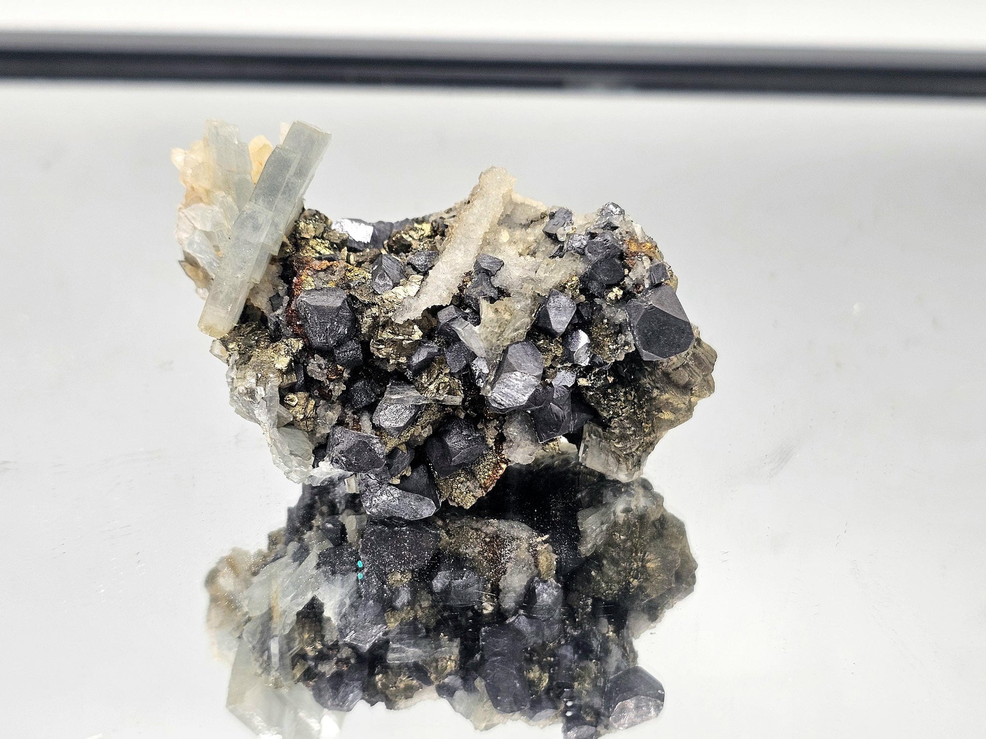 Beautiful combination crystal featuring Blue Baryte, Galena, and Chalcopyrite, showcasing a rare blend of colors and textures from Morocco.