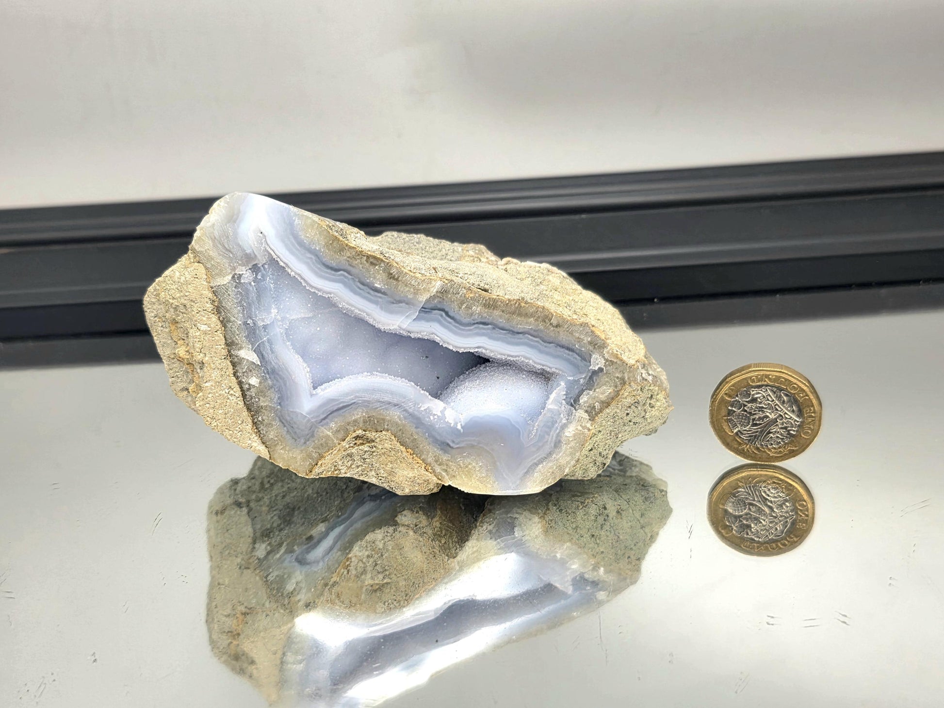 Sparkling druzy formation inside Blue Lace Agate