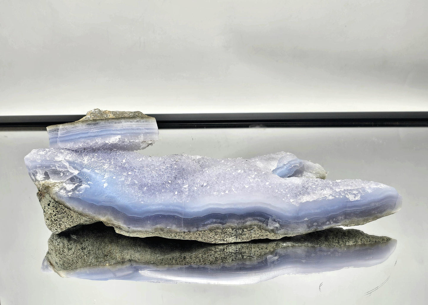 Blue Lace Agate geode with Quartz druzy, perfect for adding a natural touch to home interiors.