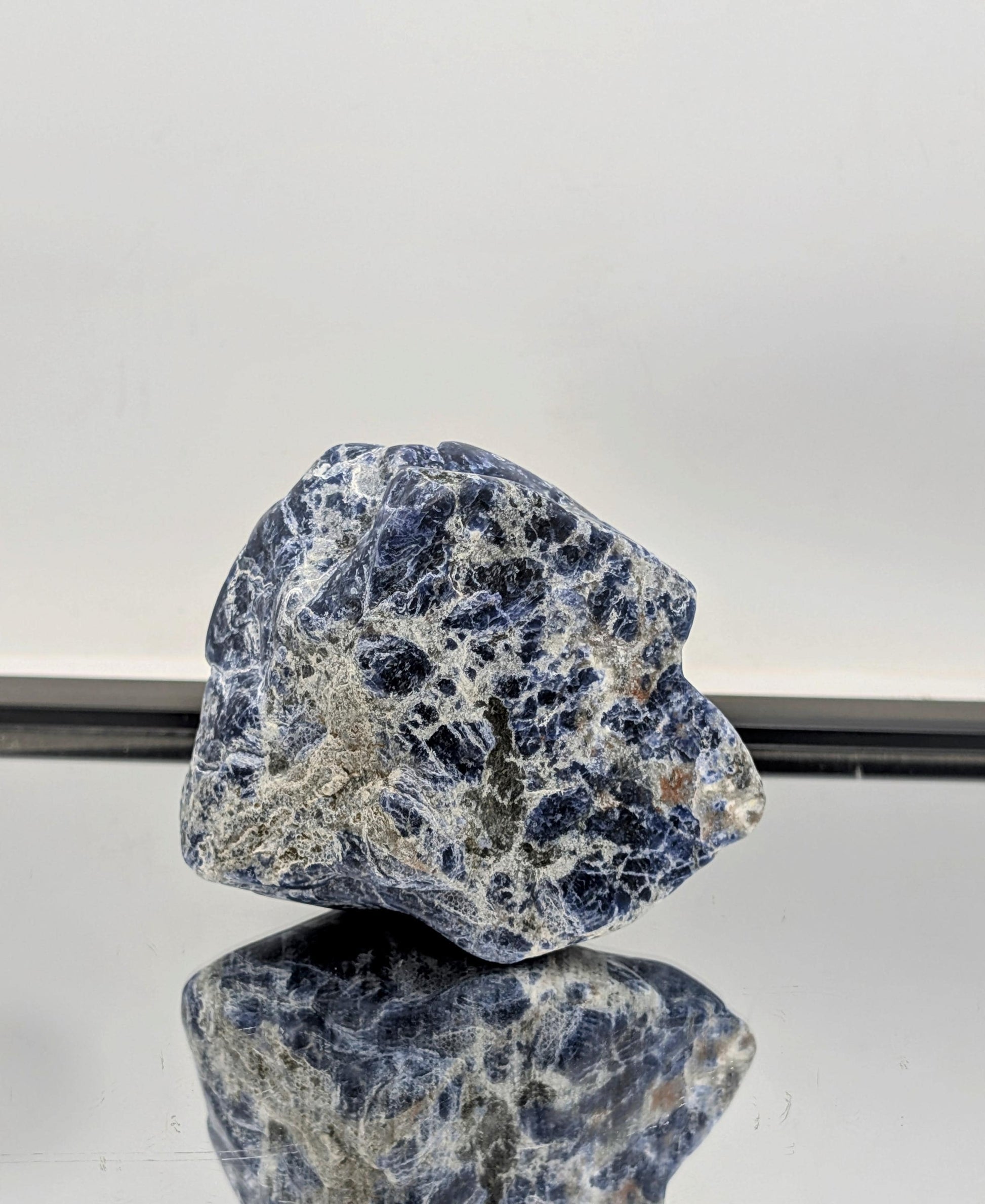 Large blue Sodalite crystal freeform styled for home décor.
