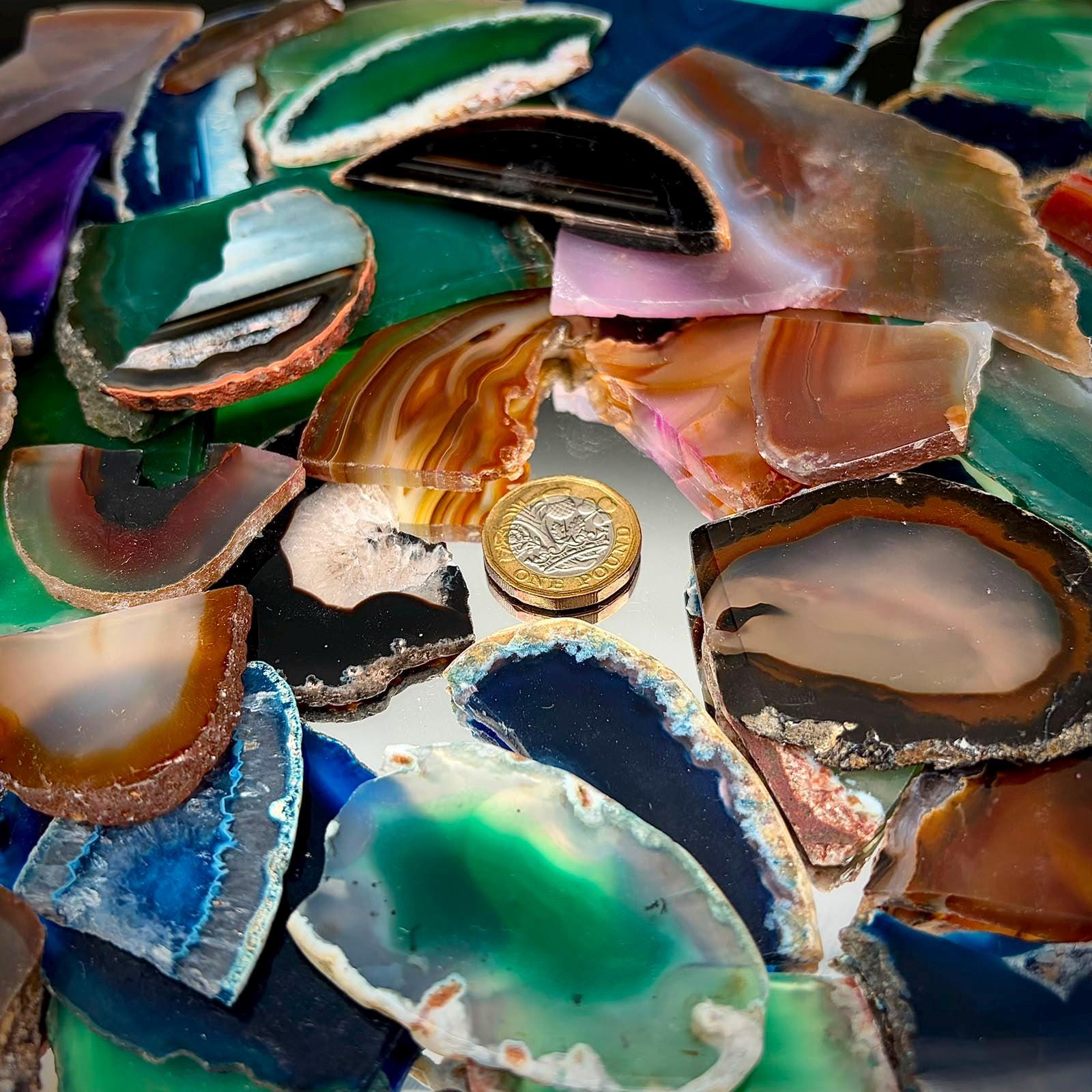 Assorted dyed agate slice pieces with irregular edges for mosaics, mixed-media art and crystal craft supplies.
