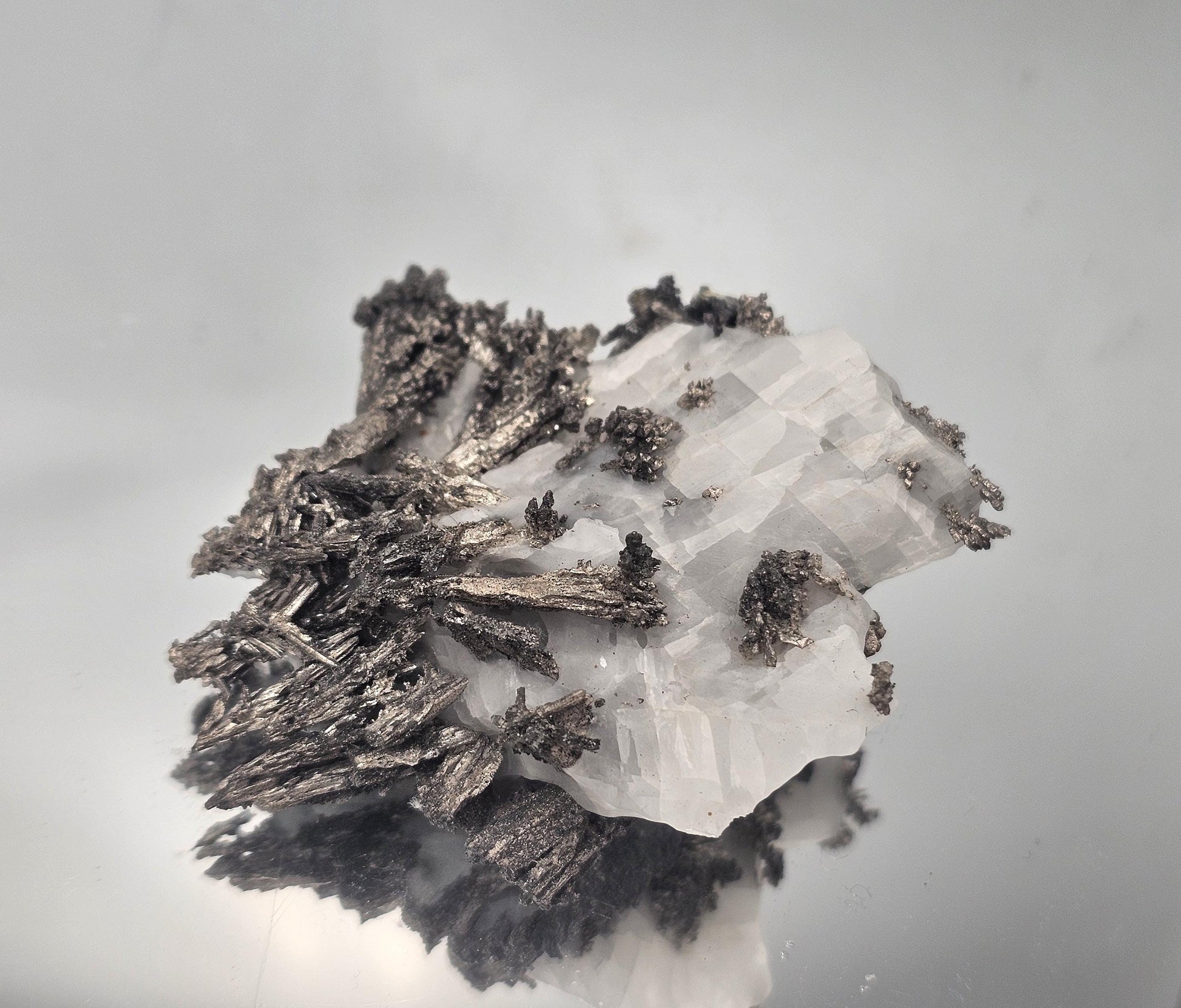 Unique collectible of Native Silver on Calcite Matrix with stunning metallic formations.
