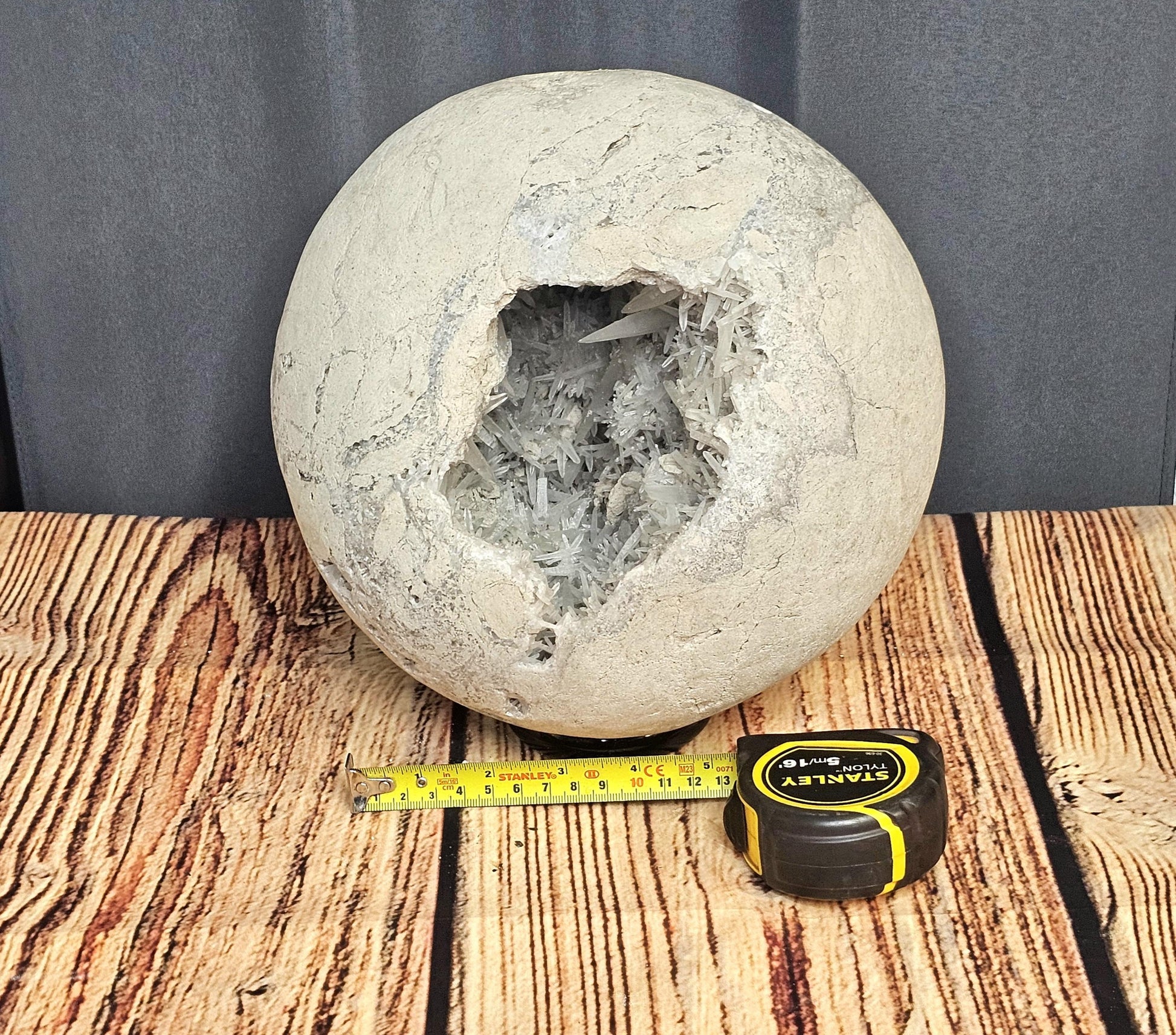 Close-up of Celestite Geode Sphere with fine needle crystals, highlighting its delicate textures.