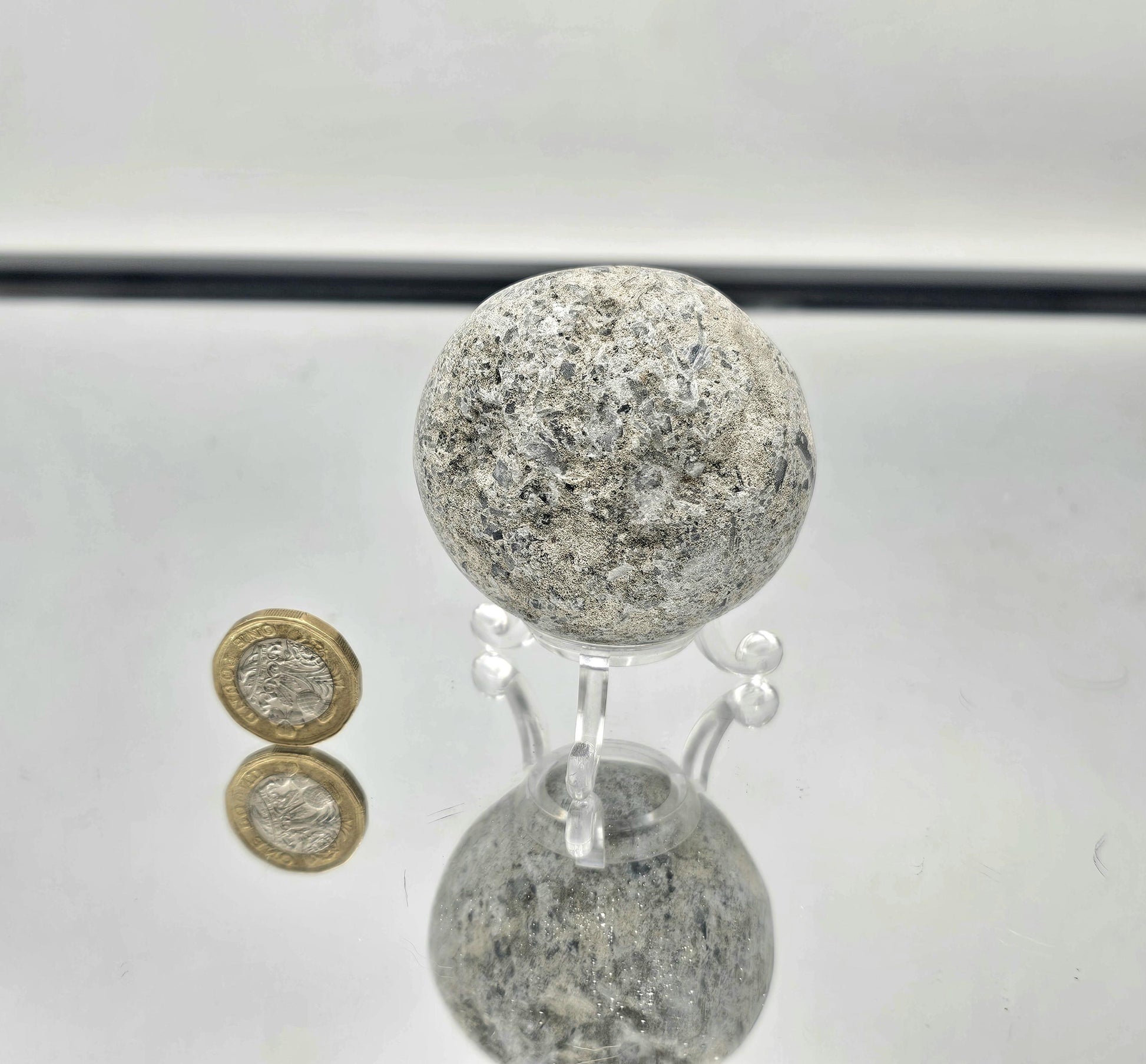 Celestite geode sphere showing fine needle crystals, emphasizing the unique crystalline structure and stunning blue hues.