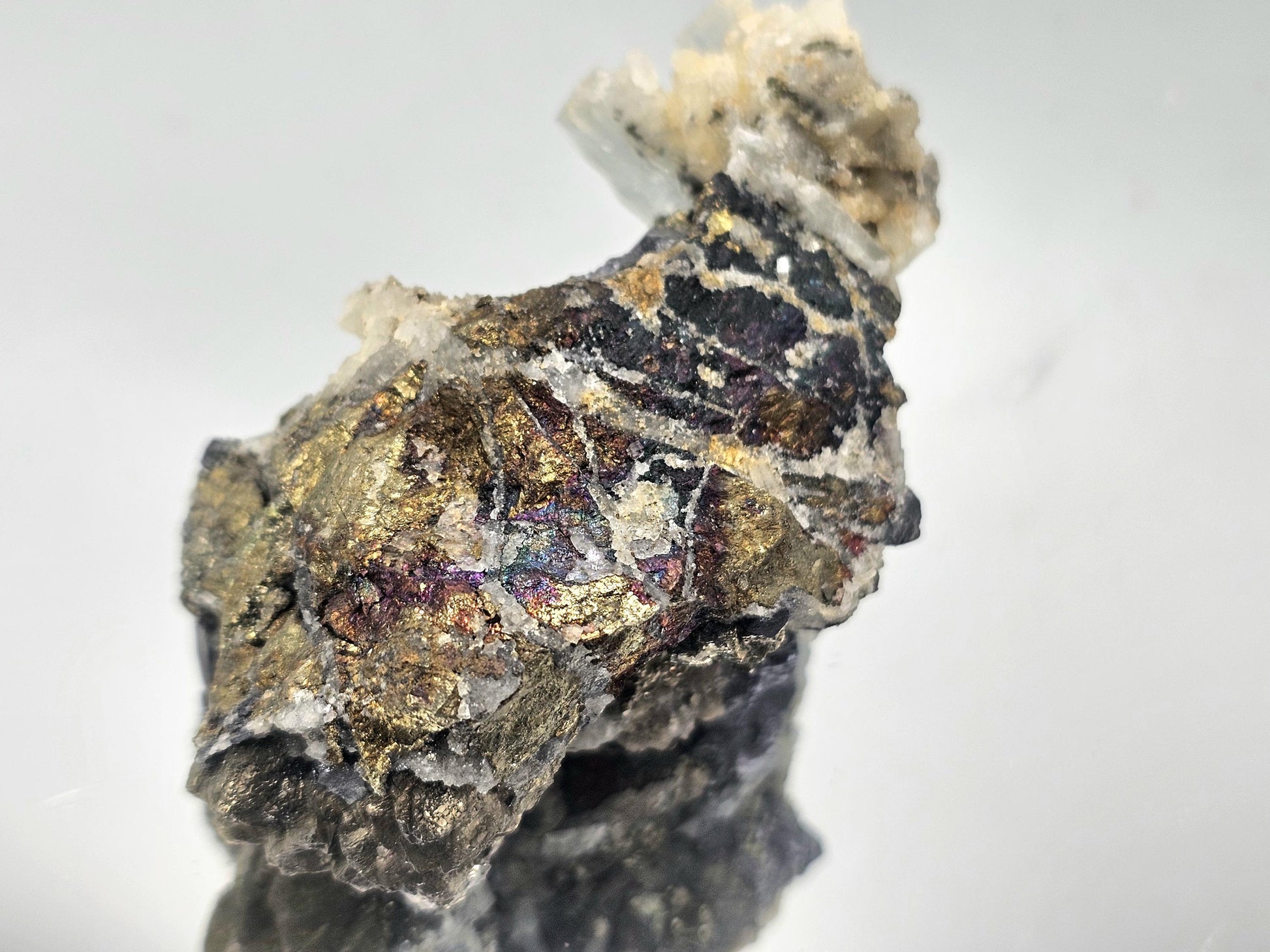 Beautiful Blue Baryte, Galena, and Chalcopyrite crystal with metallic and iridescent hues, showcasing unique mineral fusion.
