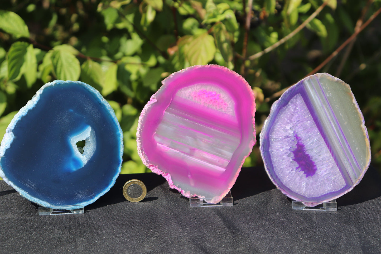 A clear two-piece plastic display stand assembled and shown upright, measuring 50 × 70 mm for minerals and crystal slices.