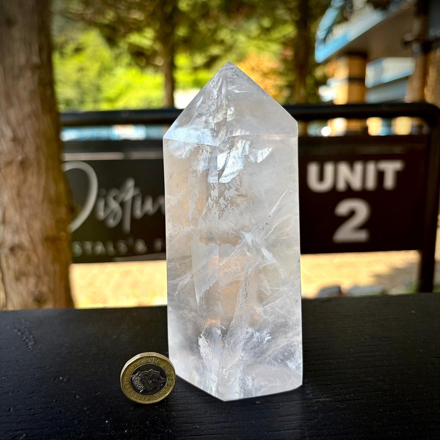 Clear quartz crystal display tower with tall polished form for shelves, cabinets and styled interiors.