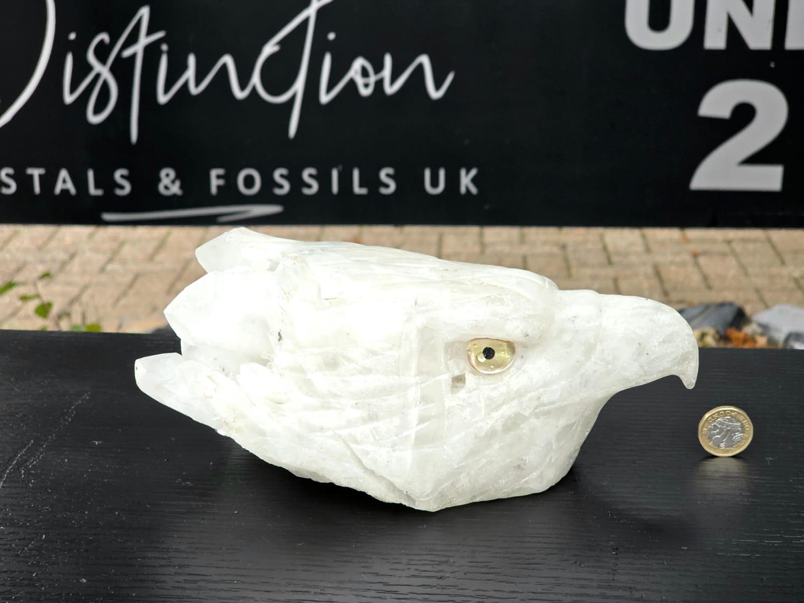 quartz eagle statue with polished finish and radiant light play.