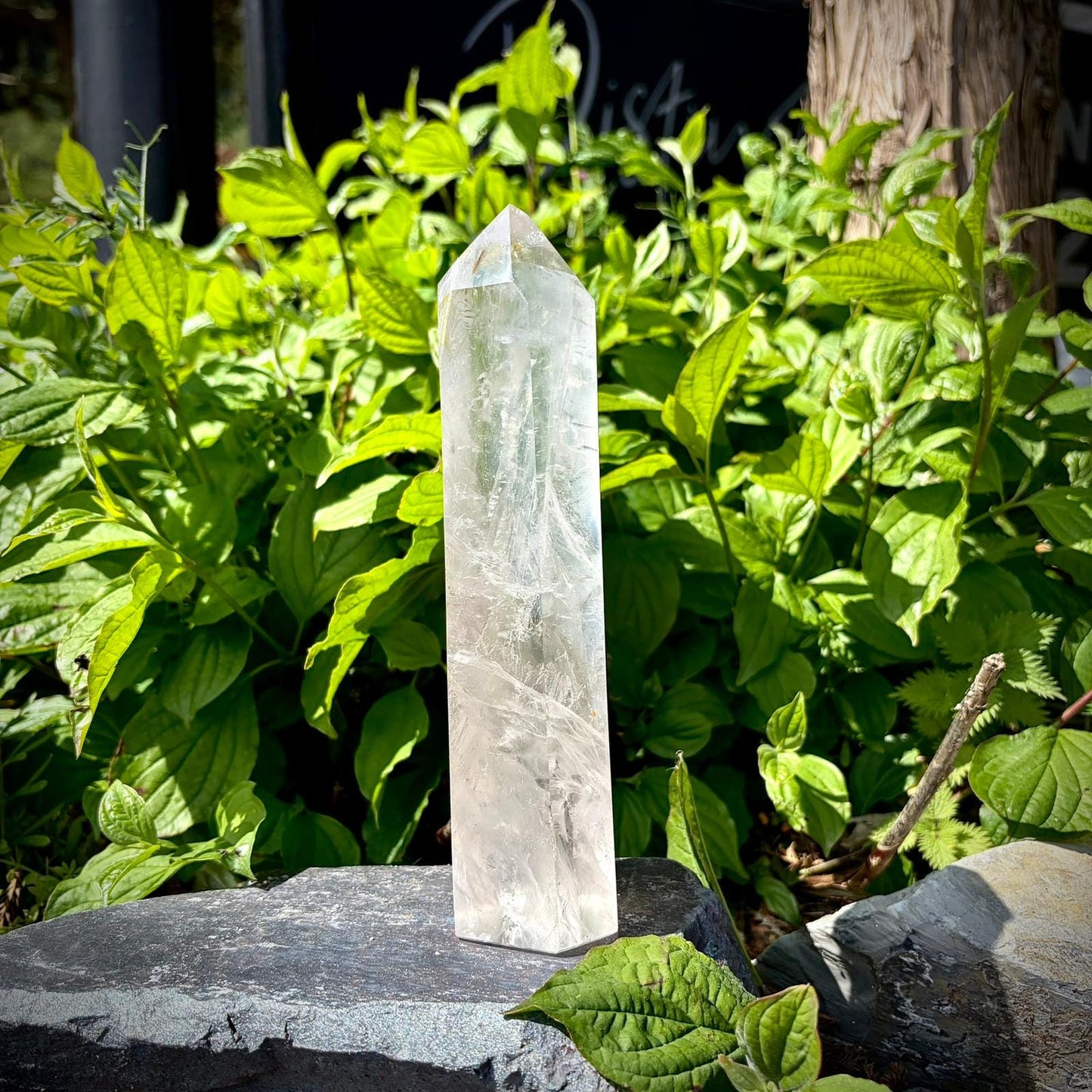 Clear quartz tower for coffee table decor with polished surface and natural internal textures.